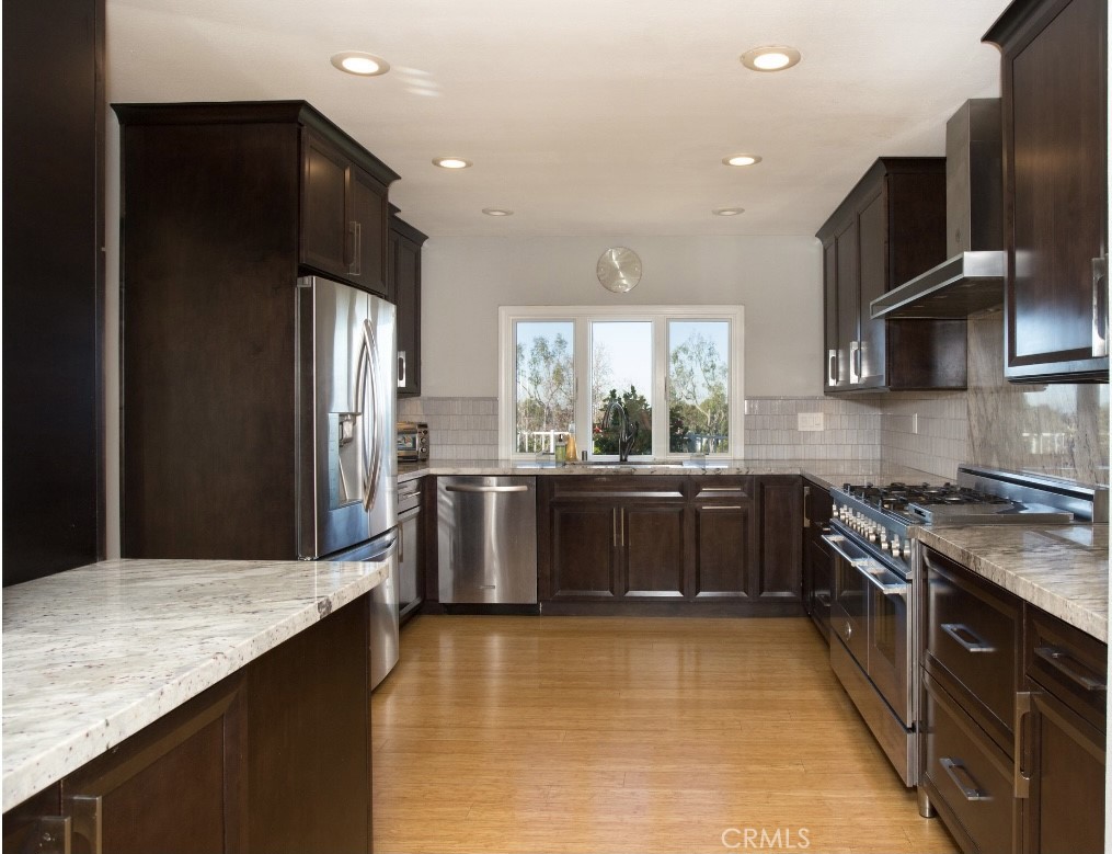 Light and bright, this expanded two-story home is tucked inside the 24-hour guard-gated community of Seaview. The open layout features a remodeled chef’s kitchen with hardwood floors, custom details, and two cozy fireplaces. The main level offers two bedrooms, a full bath, great room, dining area, and a flexible playroom or media space. Upstairs, the primary suite includes a private deck, walk-in closet, and upgraded bath, along with an additional bedroom and bath. Enjoy a low-maintenance outdoor area, two-car garage with ample storage, and access to Seaview’s pool, spa, and tennis courts—all just minutes from the beach, world-class shopping, top-rated schools, and John Wayne Airport.