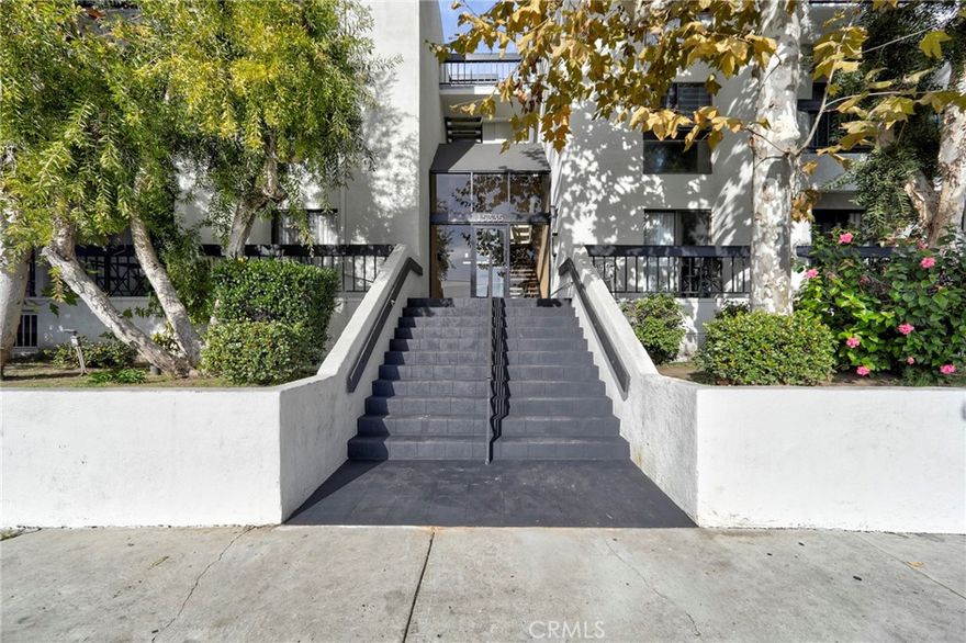 A RARE 3 BR end-unit condo in the quiet back of the building where the views are trees, birds and squirrels – you’re surrounded by nature and yet in the heart of Sherman Oaks just steps to everything! We’re in a Cul De Sac, a serene location and yet central, near everything you need! near Sherman Oaks Galleria, Near Kester Elementary Magnet School (!), walk to the HUGE Magnolia Park, Minutes to the West Side & UCLA via Sepulveda or the 405, Nano minutes to Costco, to Target, to Whole Food Store, to The Galleria (!) to the new Pavillion….walk to L.A. Fitness – need I say more? That’s another reason this opportunity is so rare!
And then the condo itself is amazing: through double-door, enter an elegant foyer w/custom travertine walls & floors that leads you to the kitchen that opens to the dining and living areas and a balcony with views of TREES. The primary BR is a super large en-suite: BR + BA plus a walk-in closet and a 2nd Balcony w/views of TREES. A full size laundry-closet in the hallway. Folks: this is A Real treat ! Amenities are: POOL,SPA, ELEVATOR. Low HOA includes Earthquake Insurance!
