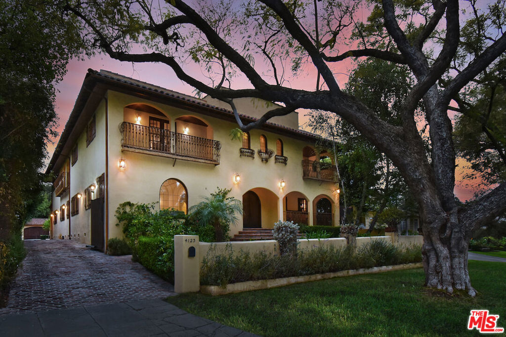 Enjoy resort living in this magical Spanish Villa, located on one of the most coveted streets in Sherman Oaks. Close to Harvard-Westlake & Buckley, close to UCLA and Century City. Truly a world unto itself, this magnificent estate includes 7 family bedrooms in the main house, including a downstairs two room in-law/home office suite with fireplace. Soaring ceilings, custom iron chandeliers, hand carved woods, hardwood floors and artisan tile-work shine throughout this custom built home. Entertain in the modern chef's kitchen with butler's pantry, huge breakfast room that overlooks the expansive yard. An impressive formal dining room can host sophisticated events. The dual family & media rooms which lead out to the covered patio, is great for the ultimate indoor/outdoor lifestyle. The stunning master suite features dual walk-in's, full dressing room and spa style bath with dual shower and infinity edge spa tub. Sun-drenched viewing terrace off the primary suite overlooks the sprawling resort-like grounds with sparkling pool & spa, large grassy yard, sport court and incredible 2 bedroom guest house with full kitchen, full bath, and washer & dryer, as well as its own front porch. Truly a rare and delightful compound. Also listed for Lease at $24,999/month. Main house is apx. 7,890 sq. ft., guest house is apx. 785 sq. ft.