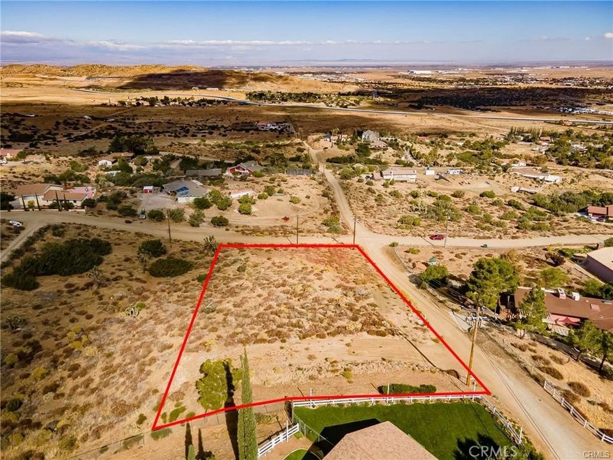 GREAT 1.25 AC LOT FOR YOUR CUSTOM HOME and this one has a WATER METER PAID FOR! Located in prestigious Ana Verde Hills. A custom built home is already built on the lot to the east so utilities in the street. And this one has a gorgeous View of the Valley and City Lights. Country feel yet close to the Freeway for commuting and close to shopping and restaurants. Don't miss this great opportunity.