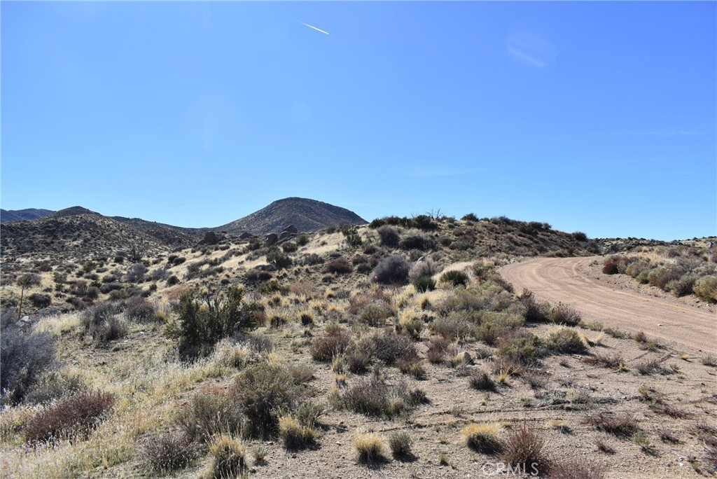 2.59 acre lot on Andes Trail on the way from town to the hot springs off Bowman Ranch Rd in Apple Valley. Could make a great AirBnB site. APN 0432-254-02-0000.