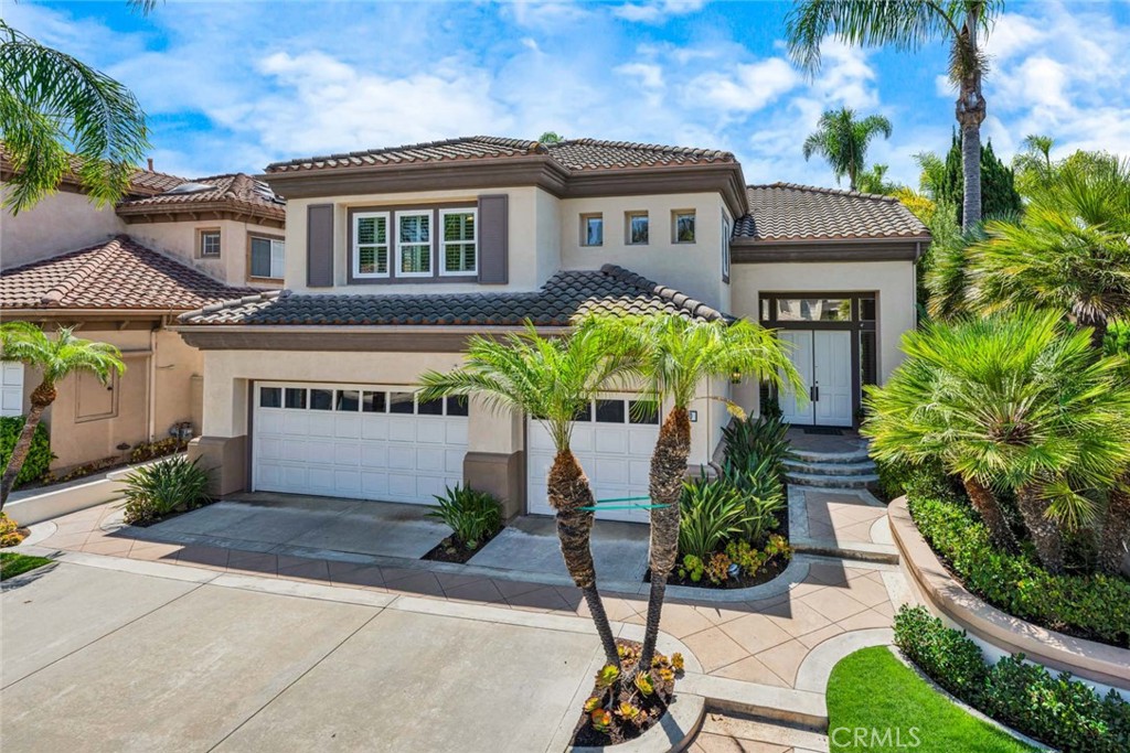 Welcome to 12460 Woodhall Way, Located on an Oversized Lot within the Highly Desirable Gated Palo Vista Community of Tustin Ranch. This Immaculate Home Features Four Bedrooms, Three Full Bathrooms (One Bedroom and Bathroom Located on the Main Floor), Bonus Room, Wood Floors, Owned Solar, New Paint, New Carpet, Whole House Water Filtration System Including Reverse Osmosis System in the Kitchen, Newer Water Heater, Majority of Windows Replaced, and Countless Additional Upgrades Throughout. The Formal Living Room Enjoys Soaring Ceilings and Opens to the Dining Room with Backyard Views. The Remodeled Kitchen Features White Shaker Cabinets, Granite Counters, Island with Cooktop, Stainless Steel Appliances, Dual Ovens, Breakfast Nook and French Doors with Backyard Access. The Family Room is Open to the Kitchen, Including a Cozy Fireplace and Built-Ins. The Expansive Master Suite Enjoys a Vaulted Ceiling, Walk-In Closet, Dual Vanities, Walk-In Shower, and Separate Tub. Indoor Laundry Room with Built-In Cabinets. Direct Access Three Car Garage with Epoxy Floors, Built-In Storage, and Tesla Battery for Use in Power Outages. The Entertainer’s Backyard Showcases a Large Grass Area, Covered Patio, Built-In BBQ with Granite Counters, Lush Landscaping, and Multiple Seating Areas. HOA Amenities Include a Gated Entrance, Resort Style Pool/Spa, and Tennis Court. A Short Walk/Drive to Award Winning TUSD Schools, Tustin/Irvine Marketplace, Tustin Ranch Golf Course, Irvine/Peters Canyon Regional Parks, and Hiking/Biking Trails. Easy Access to 5/55 Freeways and 241/261 Toll Roads. 12460 Woodhall Way is a Must See!
