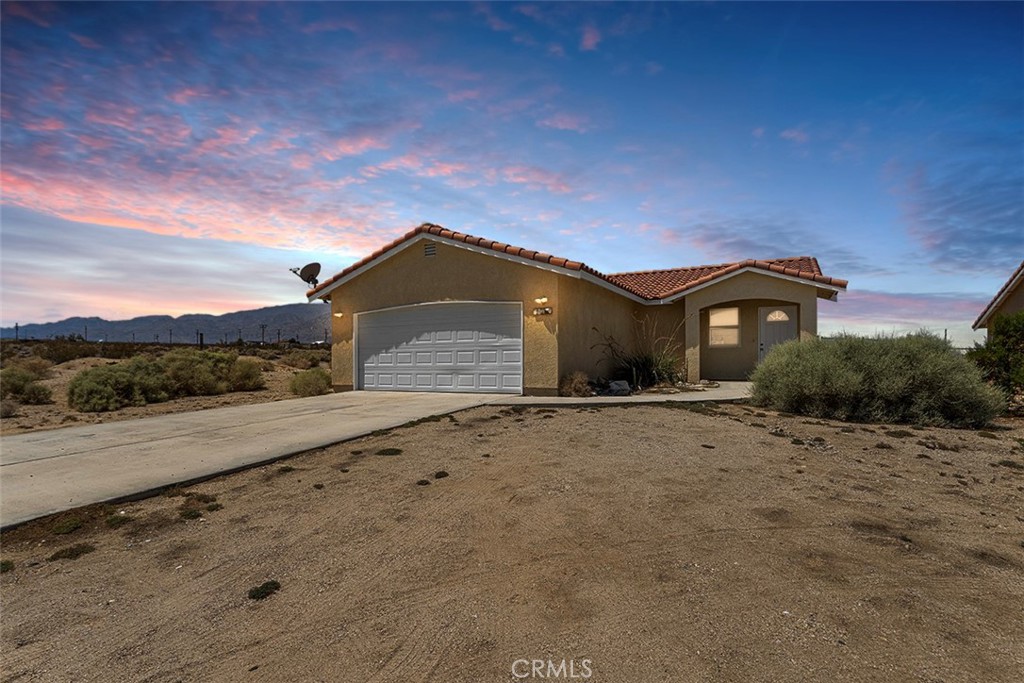 Welcome to this charming 3-bedroom, 2-bath single-family home located in the heart of Twentynine Palms, near the iconic Joshua Tree National Park. Sitting on a generous 7,800 sq ft lot, this 1,120 sq ft residence offers comfort, convenience, and unbeatable value making it the best-priced home in the area! Inside, you’ll find a functional layout with a bright living area, a well-appointed kitchen, and three spacious bedrooms. The attached two-car garage provides secure parking and extra storage space. The large backyard is a blank canvas perfect for outdoor entertaining, gardening, or relaxing under the desert sky. Ideal for first-time buyers, investors, or as a vacation rental, this home offers the perfect mix of affordability and potential in one of the most sought-after desert locations. Don’t miss this opportunity — schedule your showing today!