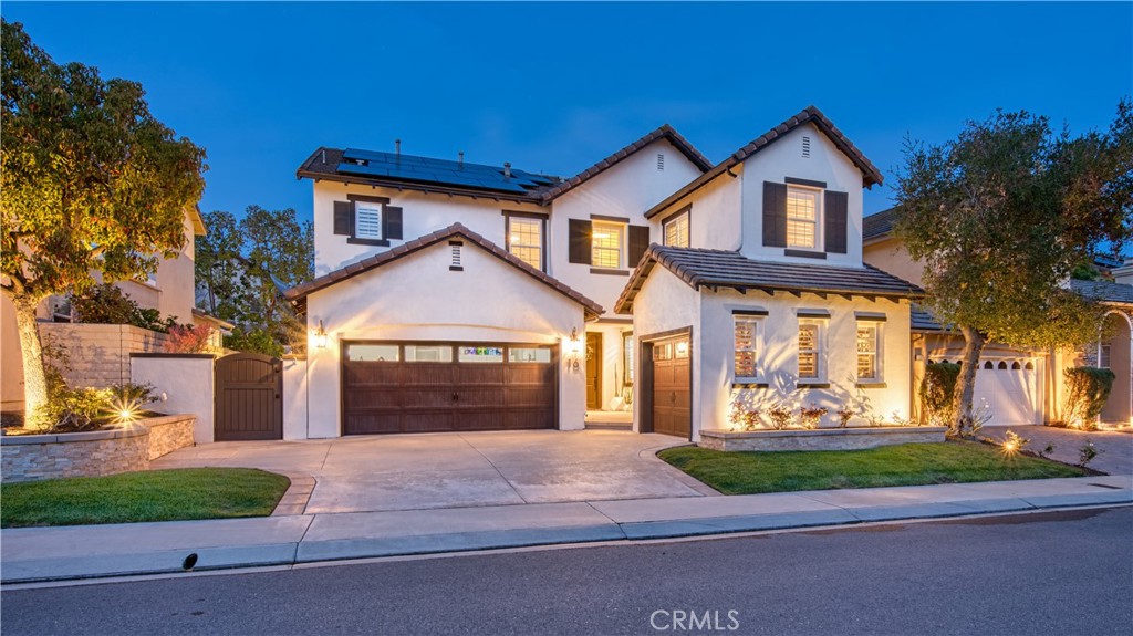 Nestled in the heart of the prestigious Coto de Caza community, this stunning residence at 16 Lyra Way is a true masterpiece of modern living. It harmoniously combines luxury, comfort, & an unbeatable location, making it the perfect sanctuary for families and entertainers alike. As you approach this gorgeous home, you'll be greeted by a charming facade. Step inside to discover an inviting circular foyer adorned with elegant flooring that leads seamlessly into the sophisticated living spaces. The grand formal living room boasts soaring two-story ceilings and an abundance of natural light, creating an airy ambiance that’s both welcoming and impressive. At the heart of the home, the gourmet kitchen is a chef’s paradise! It features sleek Carrara marble countertops with a striking waterfall island, bespoke cabinetry offering plenty of storage, and high-end appliances that cater to all your culinary needs. The adjacent private dining area, enhanced with custom built-ins & dual beverage and wine fridges, sets the stage for unforgettable dinner parties. The open family room is designed for both relaxation & entertainment, highlighted by a cozy fireplace and a built-in entertainment center. A main-floor guest bedroom with French doors provides privacy for visitors, along with a conveniently located full-sized bathroom. Venture upstairs to discover a thoughtful layout that includes four spacious bedrooms. The oversized master suite is a true retreat, featuring a luxurious ensuite bathroom and an expansive walk-in closet. Two additional bedrooms share a well-designed Jack-and-Jill bathroom. A fourth bedroom upstairs with its own en-suite bathroom offers privacy and convenience. Additionally, a versatile home office area and an upper-level laundry room with ample cabinetry make everyday living a breeze. The home is equipped with an owned solar electricity system, providing energy efficiency & savings. The new whole-house water filtering & conditioning system ensures optimal water quality throughout the home. Step outside into your own private paradise! The meticulously landscaped yard features a saltwater pool and spa, perfect for relaxation and entertaining. Host gatherings under the inviting patio cover complete with an outdoor fireplace, where cherished memories with friends and family are waiting to be made. The seamless transition between indoor and outdoor living ensures that this home is ideal for both intimate family moments and large-scale entertaining.