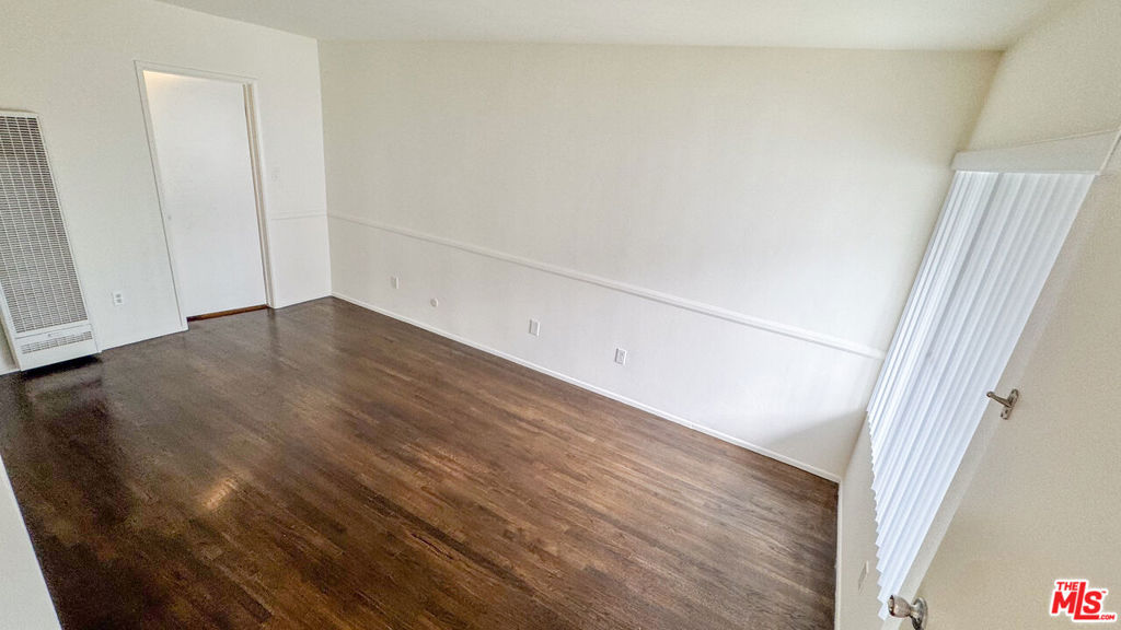 Bright and spacious top floor 1 bedroom/1-bathroom home with parking, AC and heat, lots of natural sunlight, and original details. Prime Silver Lake location just a few blocks to all the trendiest restaurants and coffee shops, clothing stores, and high-end grocers on Sunset Blvd/Sunset Junction Area. Living spaces feature an open floorplan with large windows, hardwood flooring, and a separate dining area off the kitchen. The kitchen features original white and yellow tile floors, counters and backsplash, along with white wood cabinetry, modern hardware, a fridge, stove/oven, and plenty of room for storage. Extra storage space in the hallway. The bathroom features a modern wood vanity with quartz countertops and backsplash, and a spacious shower/tub combo with a soaking tub and white tile shower walls. Bedroom is spacious, has sliding mirrored closet doors, a wall AC unit, and ample storage. Unit comes with 1 parking space. Shared laundry in building. Short drive to Echo Park, Los Feliz, DTLA, and Hollywood. Enjoy a luxury living experience in Prime Silver Lake.