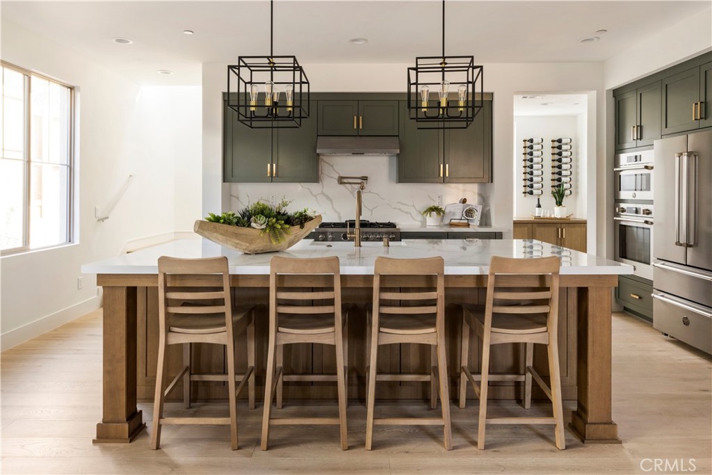 RARE OPPORTUNITY: BRAND NEW AND MOVE-IN READY IN ALTADENA! For those looking to reestablish roots - or plant new ones - this is your chance to come home to Altadena, a special place that blends tradition, resilience, and fresh beginnings. You can be an integral part of restoring and preserving the greatness of this beloved hometown. Warmington Residential is pleased to offer Plan 2 on Homesite 16 at The Oak Grove of Altadena, a Craftsman-inspired neighborhood of 16 new homes where oak trees still dot the cul-de-sac and picturesque foothills serve as a backdrop. Plan 2 on Homesite 16 is spacious and family-sized, offering 5 bedrooms, one on the main floor, 4 full bathrooms, and numerous modern upgrades throughout, as well as a cozy precast fireplace in the dining room, wood flooring, designer-curated tile, and quartz finishes, as well as gorgeous designer split-finish shaker cabinets. A professional-quality kitchen is equipped with a Bertazzoni appliance package, including a refrigerator and a stainless steel kitchen sink. Plan to relax in a freestanding tub in the primary bathroom, featuring modern plumbing fixtures and designer-selected lighting fixtures. A Ring-Pro Doorbell and many smart home features make this home fully turn-key. Prepaid Solar System included! Don't miss this special opportunity to own a beautiful home in Altadena that is ready and waiting for you to move in and settle in.