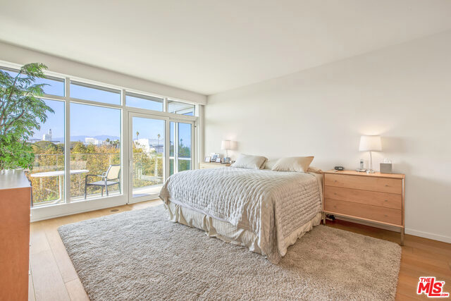 PRICE CHANGE. This condo is now the very best value on Ocean Avenue!! This very sophisticated condo has expansive views of the ocean, Tongva Park, mountains and city lights. Two bedrooms, two baths with spacious open floor plan designed by Marmol Radziner and built in 2014 by Related Company. This very light and bright unit has high ceilings, quartzite counters, oak cabinetry, Thermador stainless steel appliances, hardwood floors, spa-like master bath, walk in closets, motorized custom blinds/screens. There is a state of the art gym, 24 hour concierge, security, two side by side parking spaces, extra storage. There is a private Skybridge Lounge for residents with a gourmet kitchen, fireplace, great views, tastefully furnished for entertaining. The neighborhood has many restaurants, shops and places for walking. Near the Pier, Santa Monica beaches and all transportation. Great opportunity to enjoy a Santa Monica beach life style in an elegant home!