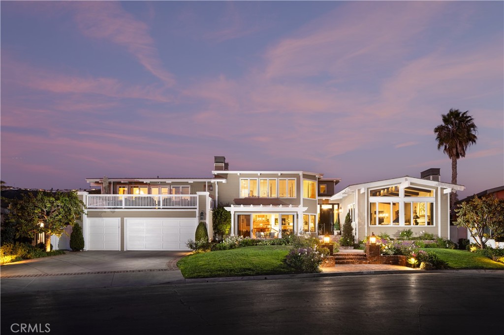 Step into a world of timeless sophistication and refined coastal living within the prestigious guarded gates of Monarch Bay in Dana Point. This exceptional residence boasts breathtaking panoramic ocean and Catalina Island views as your daily backdrop and was thoughtfully reimagined through an extensive remodel in 2003, which also included the addition of approximately 1,500 square feet to create the home’s expansive and luxurious primary suite. Designed with an open and airy layout, this home embodies elegance and offers an unparalleled lifestyle of beauty and relaxation.
From nearly every principal room, enjoy sweeping views of the Pacific and Catalina that elevate daily living into an extraordinary experience. The ocean-view living and dining rooms are ideal for entertaining, with the dining room enhanced by a wet bar and an expansive custom 1,200-bottle wine room. The chef’s kitchen, centered around a large island, is equipped with premium Sub-Zero, Bosch, and Thermador appliances. A large bonus room with spectacular ocean views opens to a sunny deck, providing the perfect space for gatherings or quiet moments of relaxation.
With generously proportioned interiors, this home is designed to accommodate both intimate living and hosting on a grand scale. The serene primary suite offers romantic ocean views, a private sitting area with a fireplace, a spa-inspired bath, and custom walk-in closets. Throughout the home, exquisite details such as soaring ceilings, hardwood and travertine flooring, plantation shutters, and crown molding underscore its timeless appeal.
The expansive backyard is an entertainer’s paradise, featuring lush garden-like landscaping, a spa, custom fireplace, BBQ bar, and a five-hole putting green. As a resident of Monarch Bay, enjoy private beach access and exclusive clubhouse amenities managed by the renowned Waldorf Astoria resort. Known as one of Southern California’s most exclusive and desirable coastal communities, Monarch Bay offers an unrivaled lifestyle of privacy, luxury, and distinction.
This is more than a home—it’s a lifestyle defined by elegance, coastal beauty, and timeless sophistication.