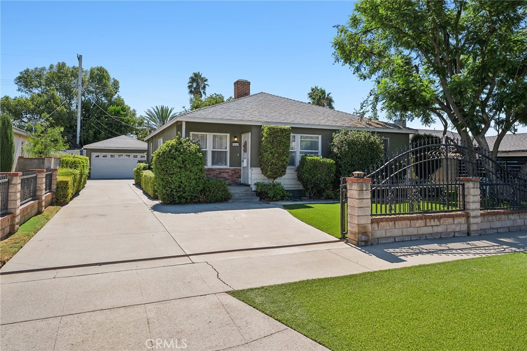 Welcome to this charming gated property nestled in a desirable pocket of Arleta! This well-maintained home features a beautifully landscaped turf yard, a recently replastered sparkling pool, and a long driveway leading to a detached garage—perfect for extra parking or potential ADU conversion. The newer roof adds peace of mind, while the covered patio offers a great space for outdoor entertaining. Inside, you’ll find warm wood flooring, ceiling fans throughout, and a cozy fireplace in the main living area. The third bedroom has been opened up to create a spacious second living or family room but can easily be converted back if desired. This home combines comfort, convenience, and curb appeal—don’t miss the opportunity to make it yours!