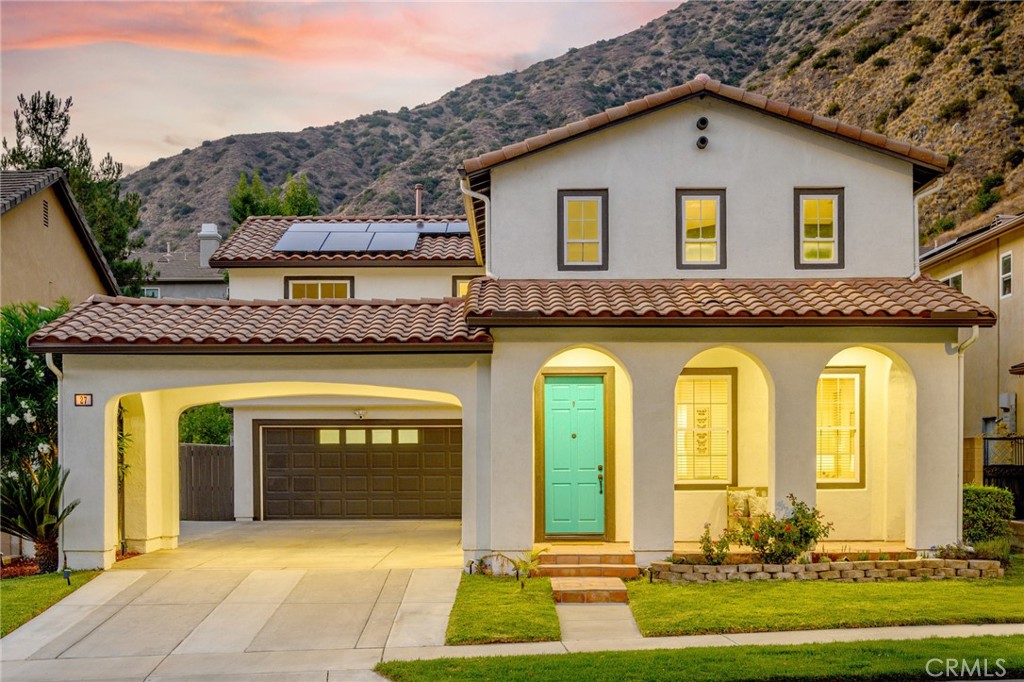 Nestled against the stunning backdrop of the San Gabriel Mountains and the scenic San Gabriel River, this beautifully remodeled 4-bedroom/3-bathroom Spanish-style home is located in the exclusive, gated Mountain Cove community — offering 24/7 security, peaceful surroundings, and resort-style amenities.
Built in 2003 and meticulously updated, this move-in ready home boasts an open-concept modern floor plan with a formal living room and a spacious great room that seamlessly connects the remodeled kitchen, dining area, family room, and half bath.
Home improvements include: September 2025 new interior paint throughout, 2023 new exterior paint, August 2025 kitchen remodel, 2023 primary suite bathroom remodel, 2022 new HVAC system (new central air & heat), 2023 new 30 year double layer underlayment roof, 2023 new Evervolt solar system (paid for, NOT leased), 2024 updated electrical, 2024 garage wired for dual EV car chargers, 2025 switches and outlets updated, 2023 new hot water heater, 2023 new rain gutters, 2024 new wifi connected smart sprinkler controller & updated irrigations system, and 2022 tented for termites.
The remodeled kitchen features new quartz countertops, new porcelain kitchen sink with brass faucet, new stove top, and the kitchen cabinets have been freshly painted and adorned with new hardware.
Upstairs you’ll find four spacious bedrooms and two full baths. The primary suite is a true retreat with walk-in closet, and a luxurious remodeled bath that includes double sinks, soaking tub and separate shower. The primary suite shower features Carolina Bay polished ceramic turquoise tiles and the bathroom flooring is honed Bianco Carrara marble herringbone mosaic tile. The upstairs laundry room is centrally located for convenience.
One of the highlights is the fourth bedroom, reimagined as a library with built-in bookcases that cleverly conceal a secret room—perfect as a hidden office, reading nook, or walk-in closet.
Mountain Cove is a storybook-like gated community with tree-lined streets, lush landscaping, and a welcoming small-town feel. HOA amenities include a resort-style pool, spa, clubhouse, park, and playground. Nature lovers will appreciate the nearby trails, perfect for hiking and biking.
This is a rare opportunity to own a turnkey home in one of the most picturesque and private communities in the San Gabriel Valley. Don’t miss your chance to enjoy the best of modern living, surrounded by nature!