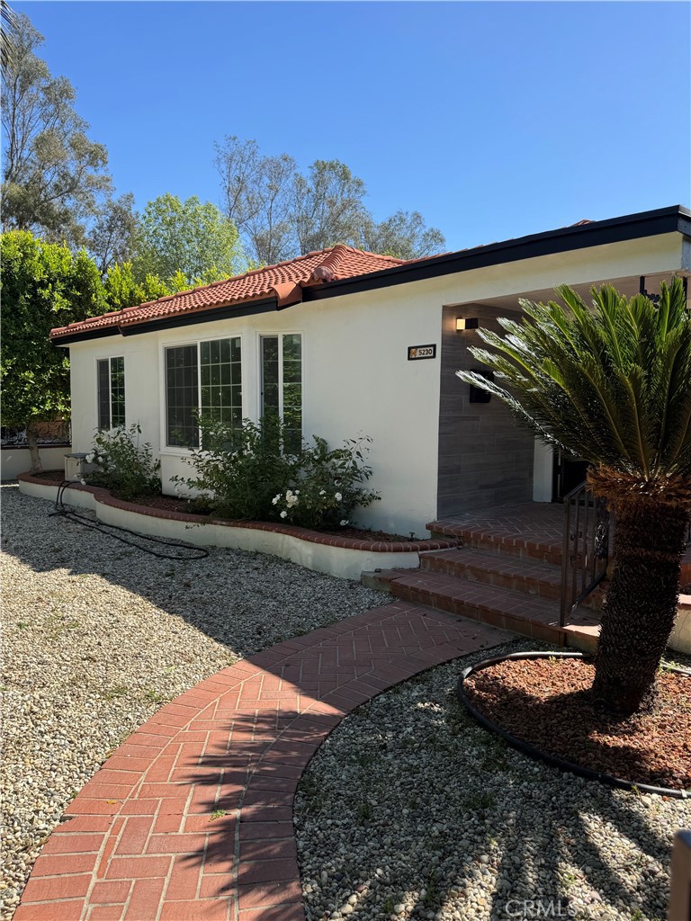 Beautifully remodeled 3-bedroom, 3-bathroom home in the heart of Encino. This single-story property features an open floor plan with an abundance of natural light, wood-look tile flooring, and recessed lighting throughout. The gourmet kitchen offers quartz countertops with striking waterfall edges, custom cabinetry, and modern finishes. All three bathrooms have been tastefully updated with designer tile, glass shower enclosures, and sleek fixtures.
The spacious backyard includes a sparkling pool, spa, and covered outdoor bar area, ideal for entertaining. A detached 2-car garage and extended driveway provide ample parking. Located near major shopping centers, dining, and within a well-regarded school district, this turnkey home combines style, comfort, and convenience in a sought-after neighborhood.