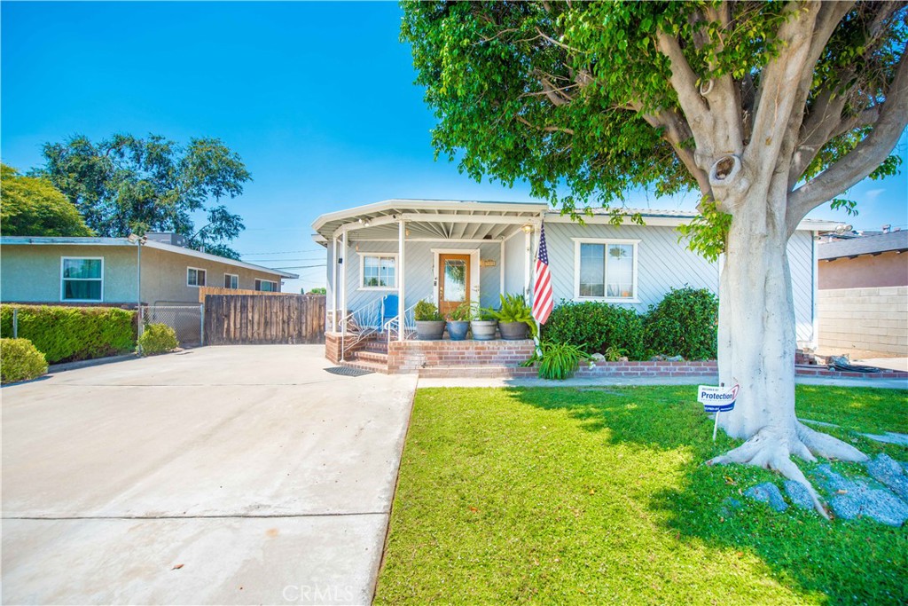Welcome to 9378 Palmetto Avenue, a beautifully upgraded 3-bedroom, 2-bathroom home offering approximately 1,450 square feet of living space on a generous 8,624 square foot lot. This one-of-a-kind property blends timeless charm with high-end custom finishes throughout. Inside, the gourmet kitchen is a standout, featuring a huge built-in, counter-depth Frigidaire side-by-side refrigerator, an abundance of custom cabinetry, and thoughtfully designed workspace perfect for any home chef. The living spaces showcase real custom-milled wood flooring, adding warmth and craftsmanship rarely found in homes at this price point. The interior flows effortlessly to the expansive backyard, designed with entertaining and functionality in mind. You'll find an outdoor kitchen setup complete with a new butcher block countertop, a sink with garbage disposal, and even a dishwasher—truly an extension of the indoor living space. A fully stick-built 11 x 13 shed offers additional storage or workspace, and a spacious 2-car garage adds everyday convenience. The property includes two separate driveways, both providing access to the backyard, making it ideal for storing recreational vehicles, trailers, or boats. RV parking, raised garden beds, and ample space for toys and hobbies complete this versatile and unique outdoor space. This home is perfect for buyers seeking a move-in-ready property with custom character, thoughtful upgrades, and room to grow. Whether you're looking to entertain, garden, store your toys, or simply enjoy a beautifully finished home, 9378 Palmetto Avenue offers it all.
