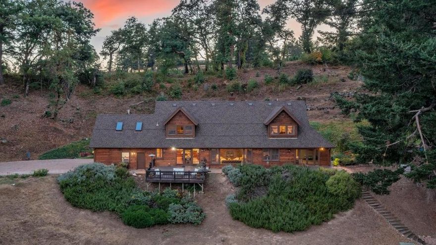 Absolutely stunning Skyline Blvd custom home with sweeping valley views! From the moment you enter, you're greeted by an open floor plan, soaring vaulted ceilings, and walls of windows that capture breathtaking vistas. The interior showcases the finest craftsmanship and finishes, including a gourmet kitchen with a professional Thermador range, dual dishwashers, a wine refrigerator, custom cabinetry, and a cleverly concealed TV. The dramatic living room features a stone fireplace, open-beam ceilings, and expansive views. The unrivaled primary suite offers a luxurious spa-like bath, private patio, and views. The main level is completed with two spacious bedrooms, a full bath, and a powder room. Upstairs, you'll find another large bedroom with views, a full bath, a family room, and a media room, ideal for relaxation or entertaining. All of the bedrooms feature spacious, walk-in closets. Adding incredible versatility, the property includes a separate 3-bedroom, 1.5-bathroom guest house of approximately 1,260 sq. ft., complete with its own garage and private driveway, perfect for extended family, guests, or rental income. Additional features include Frontier Fiber internet and award-winning Los Gatos schools.