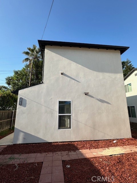 Completely remodeled and located on a quiet tree lines street in a beautiful pocket of Reseda. 2-bedroom, 2-bathroom home offering almost 800 square feet of thoughtfully upgraded living space. Designed for those who value both style and substance, this residence seamlessly blends everyday comfort with elevated California living. Step inside to discover beautiful wood floors that flow throughout, setting the tone for a warm and polished interior. Kitchen is totally remodeled with Quartz countertops and loaded with new appliances. The open-concept layout centers around a sunlit interiors perfectly positioned for connection and conversation. Fresh paint, all-new hardware and updated lighting infuse each room with a contemporary touch, while abundant natural light enhances the home's bright and airy feel. Outside, the front-yard provides ample parking along with a serene greenery and gravel landscaping. With its prime positioning, generous outdoor space, and tasteful upgrades throughout, this home offers both privacy and presence in a peaceful, close-knit community.