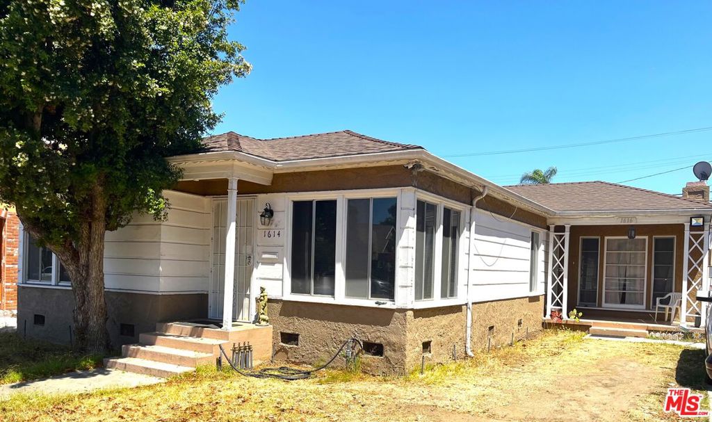 Located in the heart of Picfair Village and Wilshire Vista, one of Los Angeles' most desirable neighborhoods, just below Miracle Mile. This 1939 duplex is brimming with original features, character, and timeless charm. Set on a spacious lot, the property offers 1,807 square feet of living space with a total of 3 bedrooms and 2 bathrooms. Loved by the same family since 1967, this property is a rare find in today's market. Whether you envision restoring its classic details, modernizing for today's lifestyle, or creating an income-producing investment, the possibilities are endless. Enjoy tree-lined streets, vibrant local dining, and easy access to Beverly Hills, the Grove, and Museum Row, all just minutes away. Opportunities like this do not come around often. Schedule your visit today before it is gone.