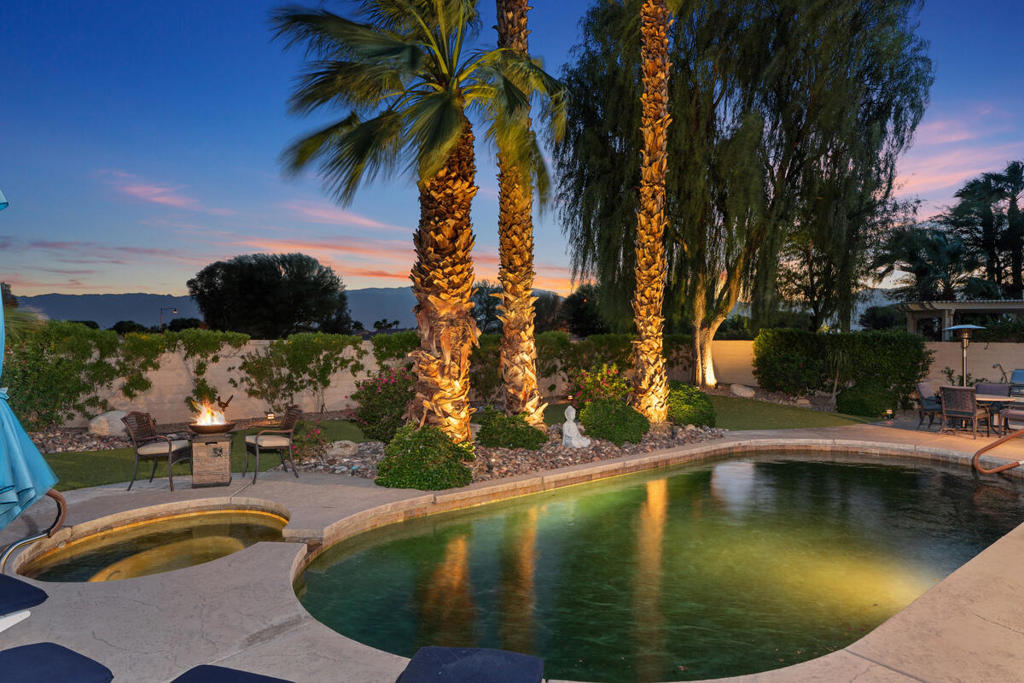 Wait till you see the spectacular panoramic view of the Santa Rosa Mountain range from your estate sized pool home that offers luxury living year-round. This home has been recently refreshed and is ready to move-in! The property is being offered by the original owners, who have added numerous upgrades and amenities. Enter through a paver front courtyard to a living/dining room featuring large glass sliding doors that offer clear mountain views. The Dorado model home features large rooms, two bedroom suites, and an office or den situated between them. The primary suite features a remodeled walk-in shower, and closet with triple rod storage and built-in laundry hampers. The kitchen has been recently updated with white cabinets, a Fisher-Paykel two-drawer dishwasher, Cambria stone countertops and backsplash, and is open to the living area and sunroom/kitchen dining space. There is a half bath for guests and a large utility room that includes plenty of storage for all the essentials and supplies from Costco shopping!This floor plan is one of the few in the community with a full three-car garage. This one includes epoxy floors, NEW mini-split AC, tankless water heater, and built in cabinets and overhead storage.The truly premium south facing lot of over 10,000/sf provides you room to stretch out and enjoy the desert weather. The Black Pearl pebble tech pool is equipped with a 4 hp 'Badujet' SWIMJET, which is a swimmer's exercise dream, with a bubbling spa to loosen those muscles after your swim (all Pentair pool equipment). The low maintenance turf landscaping only enhances the view and the time to relax in your own desert oasis. Inside, there is a fireplace for use during cooler winter evenings. The upgrades list goes on with TILE FLOORS throughout except the guest suite, CROWN MOLDING, energy efficiency with the PULTE energy-saving package that includes extra insulation and dedicated solar cells. NEW Anderson windows installed on south and west sides of house for extra efficiency. The garage has an ELECTRIC CAR CHARGER. Sun City Shadow Hills is a premier 55+ community, and this home is just a short walk to the Santa Rosa clubhouse & fitness center for gym, pickle ball, tennis, bocce ball and a Nationally ranked Executive par 3 golf course. Make an appointment now to see it when it's ready!