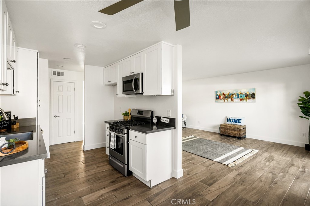 Charming single story unit located in the La Veta Monterey Condominiums of Orange! End unit with no one next to you and located on the first floor with no stairs. Boasting 2 bedrooms, 2 full bathrooms, a living room, a dining area, and a galley kitchen. Beautifully upgraded and remodeled throughout with wood tile flooring, stainless steel appliances, newer shake white cabinets and quartz countertops in the kitchen and bathrooms. Recessed lighting, central AC/ heat, spacious bedrooms, private patio off the living room, tons of natural lighting and so much more! All electrical replaced in the unit in 2019. New Copper plumbing and tankless water heater to the entire building of 12 units. Private carport with storage for the unit, plus tons of street parking right outside, making it convenient for guests and company. Community amenities include clubhouse, swimming pool, spa, playground, basketball court and multiple laundry facilities throughout. HOA ALSO COVERS WATER, TRASH AND GAS! Close proximity to Chapman University, Old Town Orange, St. Joseph’s Hospital, CHOC Children’s Hospital, MainPlace Mall, the Outlets at Orange, UCI Medical Center, and near the 22 and 55 freeways for those commuting.