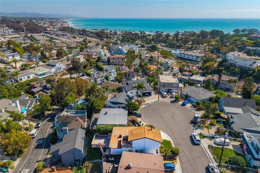 Perched above Dana Point Harbor in the heart of the Lantern District, this remodeled coastal retreat captures the essence of cul-de-sac beachside living with sparkling ocean views and seamless indoor-outdoor flow. Step through the classic Dutch door into a beautifully updated, modern luxury home featuring a brand-new kitchen with quartz counter-tops and backsplash, custom cabinetry and California Closets pantry. The inviting family room showcases wood-beam ceilings, a cozy fireplace, and French doors opening to a private backyard. The primary suite offers ocean-views, its own fireplace, an ocean-view deck, and spa-inspired bath. Upgrades include a new smart A/C and heat system, app-controlled blackout shades, custom California Closets’ throughout, a fully remodeled half bath with European marble sink and Japanese toilet, freshly painted interior and decks, a purified drinking water system, and remodeled storage space in the carport. Walk or bike to beaches, Dana Point Harbor, and world-class resorts. Just 0.7 mile to the sand at Doheny Beach, and 0.6 mile to the Saturday Farmers Market in downtown Dana Point.