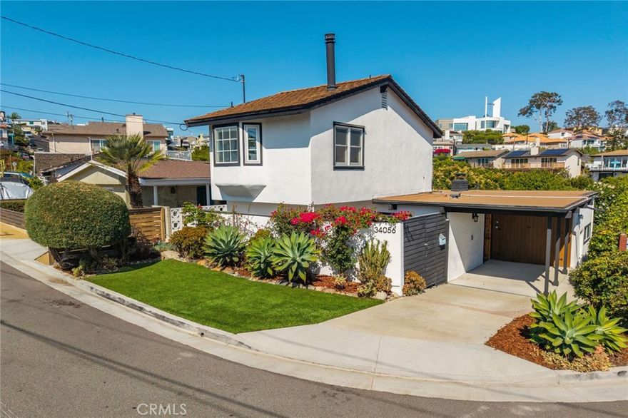 Perched above Dana Point Harbor in the heart of the Lantern District, this remodeled coastal retreat captures the essence of cul-de-sac beachside living with sparkling ocean views and seamless indoor-outdoor flow. Step through the classic Dutch door into a beautifully updated, modern luxury home featuring a brand-new kitchen with quartz counter-tops and backsplash, custom cabinetry and California Closets pantry. The inviting family room showcases wood-beam ceilings, a cozy fireplace, and French doors opening to a private backyard. The primary suite offers ocean-views, its own fireplace, an ocean-view deck, and spa-inspired bath. Upgrades include a new smart A/C and heat system, app-controlled blackout shades, custom California Closets’ throughout, a fully remodeled half bath with European marble sink and Japanese toilet, freshly painted interior and decks, a purified drinking water system, and remodeled storage space in the carport. Walk or bike to beaches, Dana Point Harbor, and world-class resorts. Just 0.7 mile to the sand at Doheny Beach, and 0.6 mile to the Saturday Farmers Market in downtown Dana Point.
