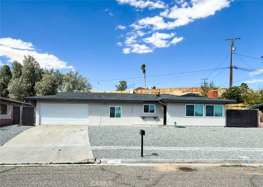 WELCOME TO THIS CHARMING 1959 HOME WITH 3-BEDROOMS AND 2 FULL BATHROOMS. THIS HOME COMES IN WITH A BANG OFFERING A BRAND-NEW SEPTIC SYSTEM ALREADY INSTALLED, 1,548 SQ FT OF COMFORTABLE LIVING SPACE JUST OFF FORT IRWIN RD. FROM THE MOMENT YOU ARRIVE, YOU’LL APPRECIATE THE LOVELY FRONT YARD WITH NEW LOW-MAINTENANCE ROCK LANDSCAPING THAT ADDS GREAT CURB APPEAL AND A TOUCH OF DESERT ELEGANCE. STEP INSIDE TO A BRIGHT AND AIRY INTERIOR, FRESHLY PAINTED INSIDE AND OUT, FEATURING BRAND-NEW WINDOWS THAT FLOOD THE HOME WITH NATURAL LIGHT WHILE KEEPING IT ENERGY-EFFICIENT. THE LAYOUT FLOWS EFFORTLESSLY, WITH A FUNCTIONAL KITCHEN, TWO WELL-APPOINTED BATHROOMS, AND INVITING LIVING AREAS DESIGNED FOR BOTH EVERYDAY COMFORT AND ENTERTAINING. CONVENIENCE IS KEY, THIS HOME OFFERS AN ATTACHED 2-CAR GARAGE THAT HAS DIRECT ACCESS TO ELECTRIC LAUNDRY HOOKUPS MAKING DAILY CHORES EASIER. AS YOU MOVE TOWARD THE BACK OF THE HOME, YOU’LL FIND A LARGE BACKYARD THAT IS PERFECT FOR ENTERTAINING OR CREATING A COZY OUTDOOR SPACE. LOCATED IN A HIGHLY DESIRED NEIGHBORHOOD, THIS HOME IS JUST A 2-MINUTE DRIVE TO SKYLINE ELEMENTARY, 5 MINUTES TO CENTRAL HIGH SCHOOL, AND ONLY 10–15 MINUTES FROM MAJOR SHOPPING CENTERS LIKE WALMART AND STATER BROTHERS. YOU CAN MOVE IN WITH CONFIDENCE AND PEACE OF MIND THIS LOVELY HOME COMBINES CLASSIC CHARM WITH MODERN UPDATES AND A PRIME LOCATION READY TO WELCOME YOU HOME!