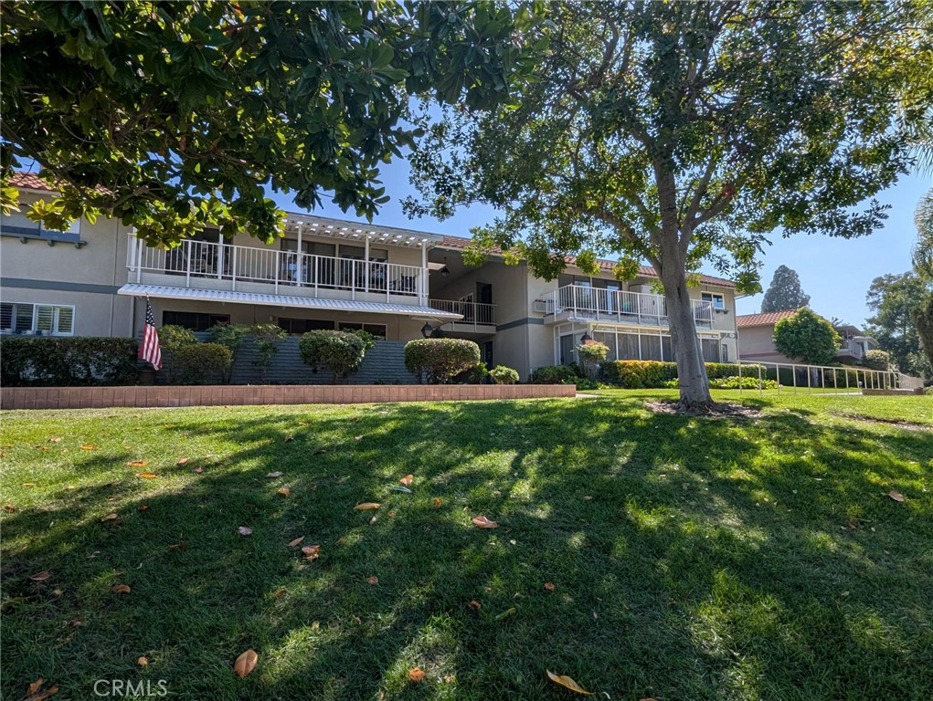Don't miss this classy CASA LINDA with its desirable "Knob Hill" location. Perfect opportunity to try out Laguna Woods Village, a 55+ community and the amazing amenities for your use! SHORT-TERM rental with direct access (NO STEPS) available Oct 1st - April 30th. This unit is fully furnished so all you need is your suitcase. It features central air conditioning, laminate flooring, dual pane windows, a kitchen with plenty of cabinets and counter space. The living room features comfortable leather sofa and recliners and a large screen TV, perfect for enjoying fall football games. The primary bedroom is an en-suite with king size bed, vanity, stall shower and full size stacked washer/dryer. The second bedroom with direct balcony access has a queen size murphy bed and small desk area. The hall bathroom features a vanity and tub/shower combo. Enjoy the sunset from your large covered balcony with beautiful treetop and greenbelt views. The unit comes with one covered carport stall directly across from the building. Laguna Woods Villages amenities include a 27-hole championship golf course, a 9-hole executive par three course, seven clubhouses, five pools/spas, an equestrian center, art studio, tennis, pickleball, paddled tennis, lawn bowling, world-class woodshop and over 200 clubs and organizations.....it's all right here!