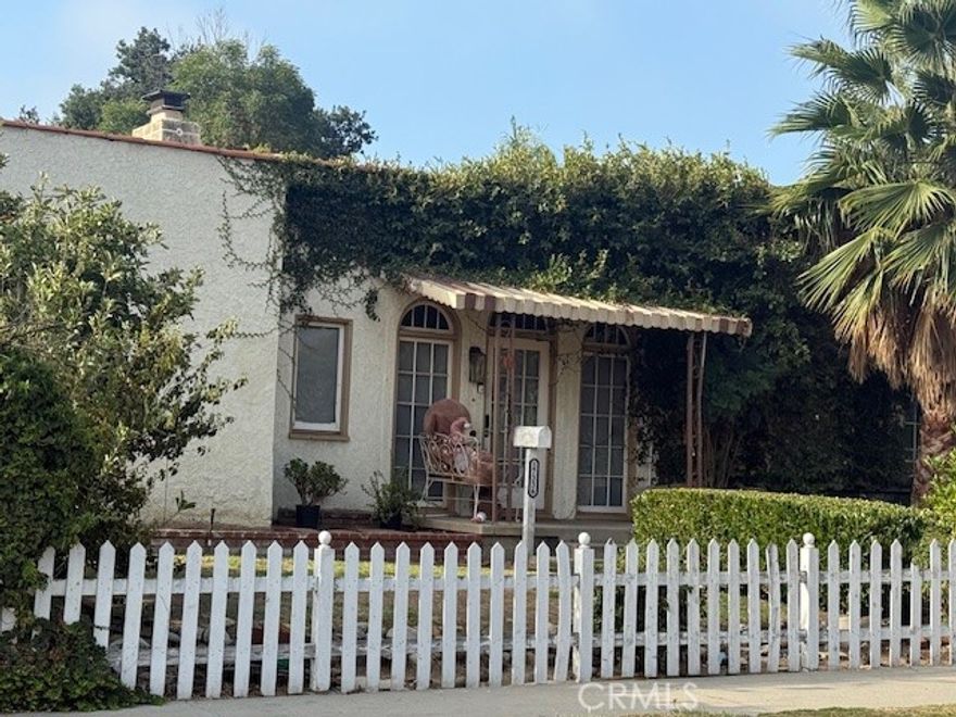 Nestled on the border of the prestigious Granada Hills and North Hills neighborhoods, this beautiful, Spanish-style home offers charm and modern convenience.  Step inside the sun-drenched, spacious living room, featuring many windows and elegant laminate flooring. The home chef will be delighted by the gourmet kitchen, equipped with abundant cabinetry, ample quartz counters, built-in appliances, a gas stove with hood, and a dual-basin stainless steel sink. The very large adjacent dining room makes entertaining a breeze.  This home features 4 bedrooms and 2 bathrooms, including a magnificent grand suite. The suite is a private oasis complete with a large walk-in closet, a cozy fireplace, and double doors opening directly to the backyard.  Enjoy the California lifestyle in the huge backyard, which features spectacular views and a covered entertainer's patio. Parking is plentiful with a long driveway offering secure off-street space leading to the 2-car detached garage.  This incredible property sits on a 8032 square foot private lot, conveniently located within walking distance of shopping, grocery stores, restaurants, and easy access to the 118 freeway.