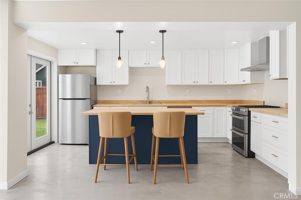 Live local in Belmont Heights! This brand-new 2 bedroom, 1 bathroom ADU packs smart design into 743 square feet and lives much larger thanks to it's open layout and indoor-outdoor flow. The kitchen takes center stage with its navy island, butcher-block countertop, white shaker cabinets, stainless steel appliances, and pendant lighting - perfect for weeknight meals or weekend hangs. Polished concrete floors add a clean, modern touch and are easy to maintain. The bathroom is thoughtfully designed, featuring a walk-in tiled shower, darling vanity, and bright lighting. Two bedrooms with great natural light offer flexibility for sleeping, working from home, guests, or extra storage. French doors open to a fenced shared backyard with a grassy lawn - ideal for morning coffee, a pup play break (yes, pets are permitted!), or a relaxed BBQ. Shared washer and dryer on-site for added convenience. All of this in a super walkable pocket of Belmont Heights - close to 4th Street/Retro Row restaurants, coffee shops, wine bars, vintage finds, and minutes to the beach, Belmont Shore, and Bluff Park. If you're looking for a move-in-ready space in one of Long Beach’s most sought-after neighborhoods, you just found it!