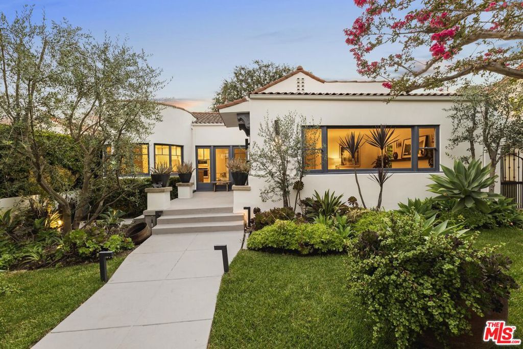 Nestled in the charming enclave of Los Feliz, this exquisite Spanish-style residence at 1929 North Oxford Avenue embodies timeless elegance. Spanning 2,172 square feet, the home has just been meticulously renovated to offer a blend of classic charm and sophistication. Upon entry, you are greeted by an open and airy living space adorned with oversized windows, inviting an abundance of natural light. The elegant wood flooring has just been refinished and extends a warm welcome, guiding you through the thoughtfully designed interiors. The gourmet kitchen, a culinary enthusiast's dream, features a large 10' island made of Mykonos Leather quartzite and reclaimed wood, new stainless steel appliances, a delightful breakfast nook, and bespoke cabinetry complete with walnut hardware. The distinguished main house includes three spacious bedrooms and two beautifully appointed bathrooms. The bathrooms have been updated with floor to ceiling handmade terracotta tiles, terrazzo floor tiles, and custom reclaimed wood vanities. A detached dedicated home office space (with bathroom) provides the ideal environment for productivity. Outside, the enchanting backyard serves as a serene retreat, ideal for al fresco dining and relaxation. The expansive 8,109 square foot lot includes a garage with ADU potential, plus additional parking. Don't miss this stunning Los Feliz gem!