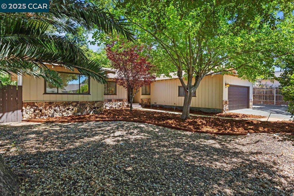 Exceptional opportunity to own a stylishly renovated, single-level home with a smart, functional layout. The spacious formal living room is filled with natural light from oversized windows that overlook the large, private backyard. At the center of the home, the open-concept family room and kitchen create the perfect gathering space, highlighted by a cozy fireplace. The kitchen has been thoughtfully remodeled with brand-new stainless steel appliances, crisp white cabinetry, quartz counters, and a generous walk-in pantry, ideal for any cooking enthusiast. A flexible bonus room provides options to suit your needs: formal dining, home office, or even an additional bedroom. The primary suite includes two large closets, a beautifully updated bathroom, and direct access to the backyard. Updates throughout include new LVP flooring, recessed lighting, modernized bathrooms, fixtures, finishes, and a fresh coat of paint, making this home move-in ready. The property also includes RV/boat parking, an attached two-car garage, central heating and air, and a dedicated laundry room. Conveniently located near Lime Ridge trails, shopping, dining, and BART, this home truly combines comfort, flexibility, and location in one incredible package.