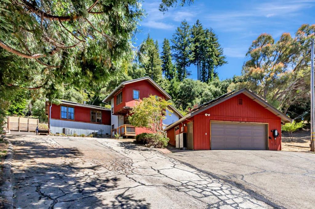 Beautifully renovated artistic mountain retreat on 3.3 sun drenched acres surrounded by nature! Soaring ceilings, skylights, plentiful windows & glass doors invite the outdoors in. The gastronomic kitchen features an enamel Belfast farm sink, Wolf 6-burner range w/griddle, double ovens & a pot filler and opens onto the expansive redwood deck for al fresco dining & BBQ's. Functional, flowing floor plan with multiple living areas: an office, a private bedroom-ensuite with an office nook & tranquil yoga/meditation loft, 2 bedrooms & a modern bathroom boasting double sinks, a soaking tub & glass shower, & a luxe primary ensuite with deck access & spacious walk-in closet w/library ladder. Relaxing spa, outdoor shower, raised garden beds, apple, pear & plum trees, deer fenced with so much room to roam, easily accommodating large gatherings & a haven for reunions, kids, pets, & farm animals. Enjoy daytime birdwatching & spectacular meteor showers & stargazing at night. Detached 2 car garage w/ EV chargers, solar panels, & Tesla Power walls ensure comfort, sustainability & affordability! Catch the school bus or metro bus nearby. Close to wine tasting, golf, hiking, and town. Easy drive to San Jose/Silicon Valley & Santa Cruz Beaches. Don't miss this one-of-a-kind mountain masterpiece!