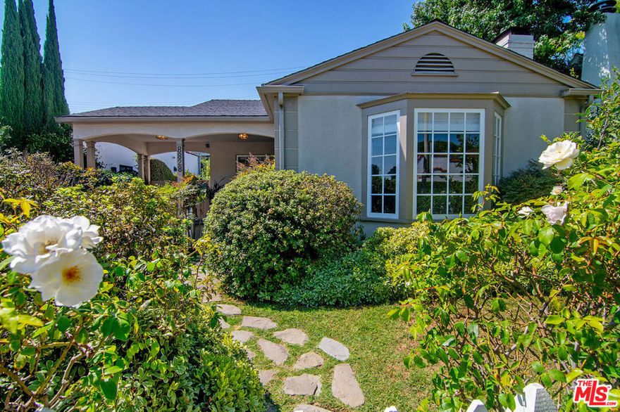 This is the  perfect West Hollywood Bungalow, completely and stylishly remodeled and ready to move right in. The main house features gleaming wood floors and boasts 2 bedrooms and 2 baths with a sun drenched living room w/cozy fireplace and large beautiful bay windows overlooking a lushly landscaped front yard that is perfectly framed with the "white picket fence" you've always wanted.  The formal dining room sits adjacent to the chef's kitchen with center island, stainless steel appliances and glass front display cabinets. There is also a huge separate laundry room with tons of storage & pantry closets. The primary suite has side by side closets and a spa-like bath with soaking tub and separate shower. The very private rear yard has mature landscaping and low maintenance hardscape pavers including a detached/permitted bonus room with a half bath. Amazing location close to all the best dining, shopping and entertainment in L.A.