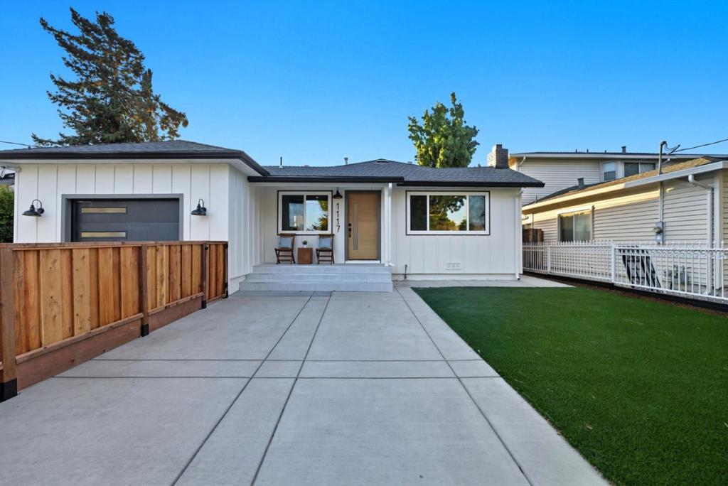 Discover 1117 Henderson Ave, a fully remodeled 3-bed, 2-bath home features laminate flooring and new recessed lighting throughout, guiding you through a bright living room, where a resurfaced micro-cement fireplace creates a sleek focal point. The new gourmet kitchen, boasts black stainless steel Bespoke Samsung appliances, high-end porcelain countertops, a convenient island counter, and cabinetry with ample storage. The primary bedroom offers a private retreat with an en-suite bath and a walk-in closet. Both updated modern bathrooms reflect contemporary style. The home also features new exterior siding, fresh interior and exterior paint, all new interior and exterior doors, and a brand new garage door, ensuring a fresh and modern feel throughout. Outside, a fenced front yard and a modern landscape featuring mulch beds, water-resistant plants, lush turf, and a charming stepping stone pathway and spacious landscaped backyard, offering an idyllic setting for outdoor gatherings. Located just moments from the vibrant downtown Menlo Park, Stanford University, and various local parks like Fremont Park, easy access to dining, shopping, cultural attractions, and outdoor recreation. With easy access to major transportation routes.