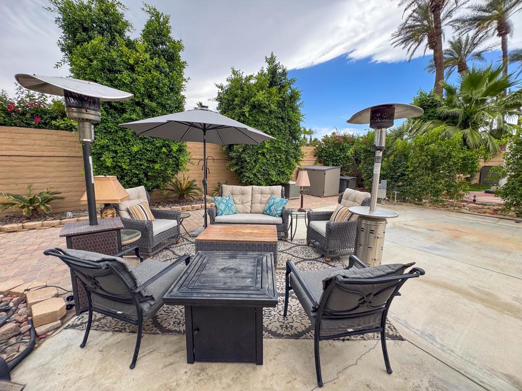 Experience your own private oasis with this beautifully landscaped luxury RV lot, featuring an expansive, wider back area that offers exceptional privacy and tranquility--perfect for relaxing or entertaining in a serene garden setting. Thoughtfully designed with comfort and convenience in mind, this north-facing lot provides ample shade and a peaceful ambiance while being just steps away from the satellite pool, laundry, and resort amenities.The well-maintained outdoor kitchen is equipped with everything you need, including hot water, an oven, two refrigerators, a sink, and plenty of storage with three rolling cabinets and deck boxes. The spacious living area is enhanced by pavers, lush landscaping, two large umbrellas, a cooling fan, and two mushroom heaters, creating the perfect environment for your enjoyment. This pet-friendly retreat is only 90 steps to the grass area, making it an ideal haven for you and your furry companions. Whether you're unwinding in the shade or hosting friends under the sun, this exceptional lot offers the ultimate blend of luxury and convenience.‍