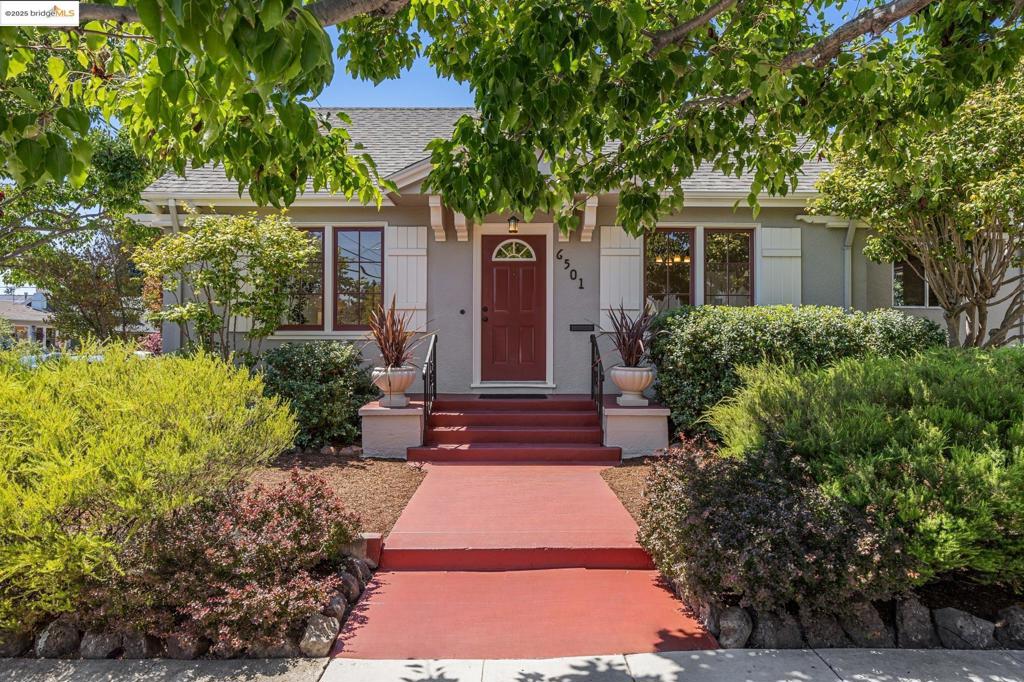 Welcome home to a meticulously maintained 2BD/1BA bungalow on a quiet, tree-lined street near the Oakland/Berkeley border. Blending classic character with modern convenience, this light-filled home features hardwood floors, period built-ins, and a beautifully tiled fireplace in the living room. The formal dining room offers the perfect setting for shared meals and conversation, connecting seamlessly to the sunlit kitchen, office nook and laundry area. The serene, landscaped backyard provides space to garden, entertain, and simply unwind. A detached garage and gated off-street parking for two cars add extra flexibility. Major system upgrades include a newer roof, foundation, electrical, plumbing, and water heater - more than charming, this home has been meticulously updated and maintained. Enjoy a central location just minutes from shops and restaurants in Elmwood, Rockridge, Temescal and Downtown/North Berkeley, Bushrod Park, Berkeley Bowl, Whole Foods and Ashby BART, . A special property not to be missed!