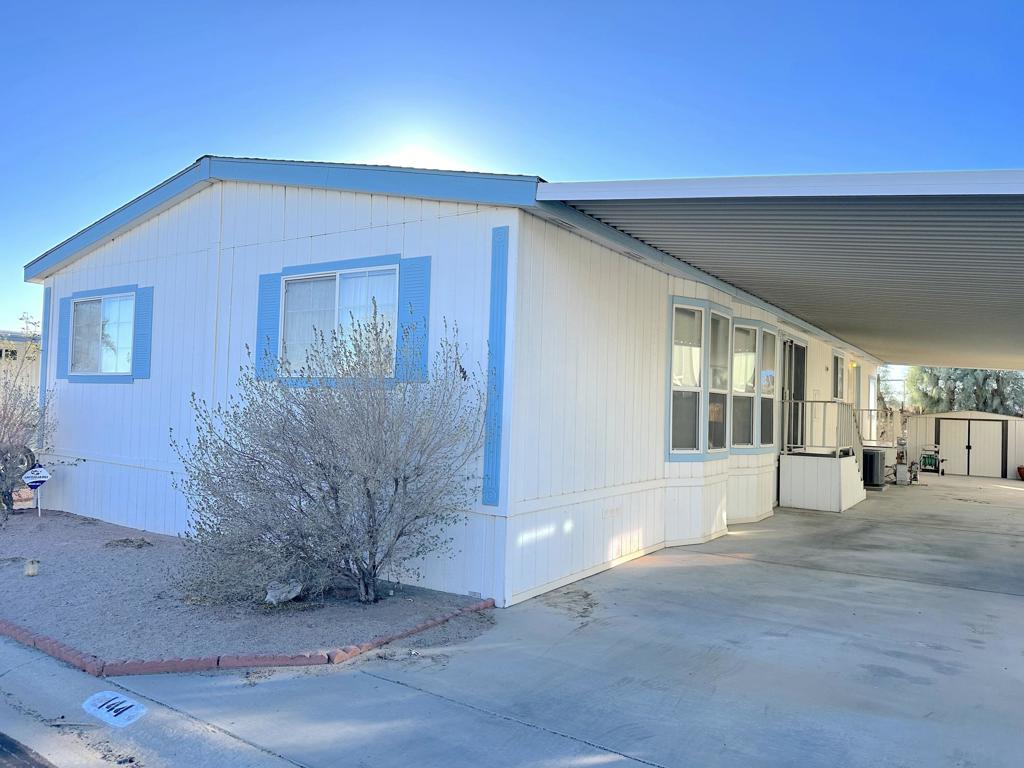 This exceptional 4-bedroom home in the desirable Skys Haven community is a rare find. Located in a gated neighborhood where you own the land, you'll enjoy low HOA fees and access to amenities like a park, clubhouse, heated pools, spas, game rooms, billiards, saunas, and a library.The home features luxurious ceramic tile flooring throughout, a newer A/C, and a new water heater . The open-concept kitchen and dining area with high ceilings create a spacious, inviting atmosphere. The home is situated on a permanent foundation with a 433A certificate, ensuring security and stability. It's the perfect blend of style, comfort, and convenience in a serene, resort-like setting.