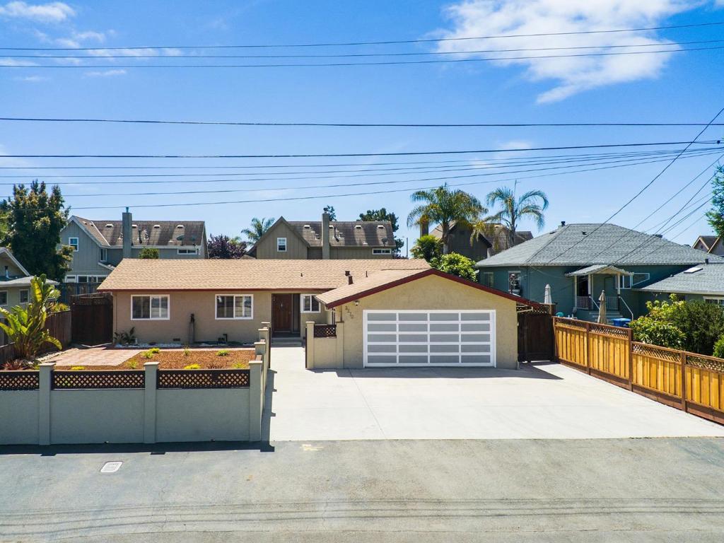 Here is the one you've been hoping existed but just haven't been able to find. Located in a quiet neighborhood on a short, side street that ends in a beautiful little redwood-ringed park. This spacious three bedroom, two-bathroom, single-story home is just minutes away from beach, shopping and all the required commercial amenities. The home boasts beautiful, oak hardwood floors with a spacious kitchen and robust dining area. Additionally, its full-length sunroom will make your eyes drool! Each bathroom is beautifully updated as well. The grounds of this oversized lot are carefully landscaped with a front yard wall for additional privacy. The backyard is super-low maintenance and includes a gazebo that is hot-tub ready along with two pergolas and a mechanized, roll-out awning for shade. The home's backyard grounds also boast a stand-alone craftsman's workshop as well as a separate shed for storage.