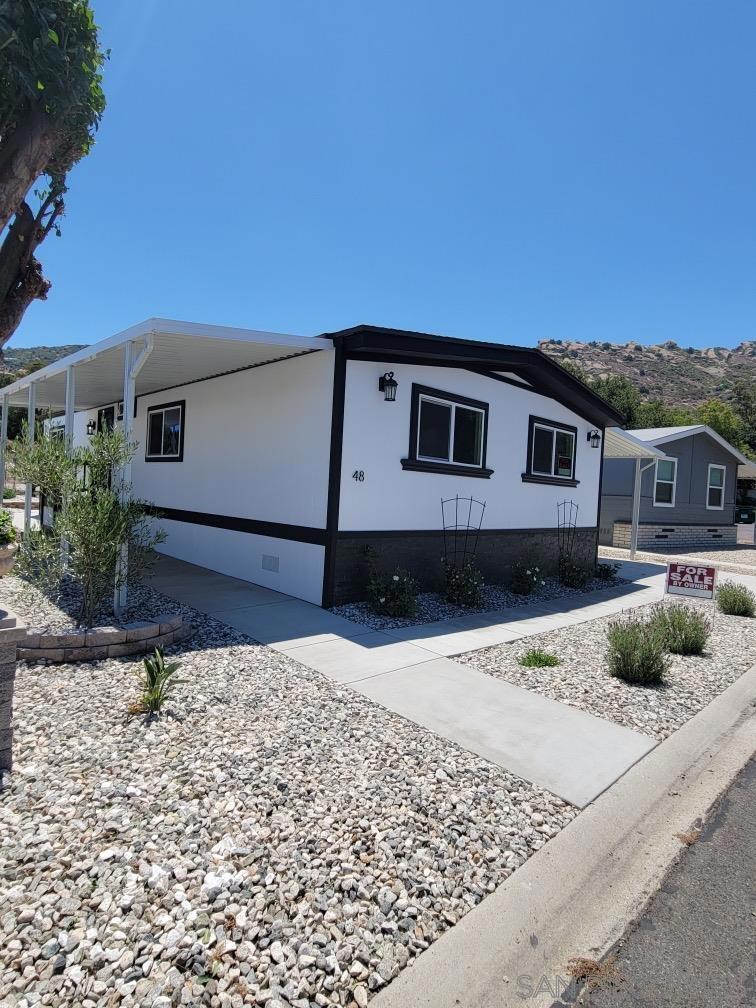Summer Special! Hurry, price just slashed! Welcome to Susana Woods Estates! This new mobile home is located in a prime location secluded in the serene Susana mountains in Simi Valley! Fully upgraded in 2024; move-in ready; double wide; NO HOA dues; space rent of only $1750/month; a few of the many features: a spacious 3 bedroom, 2 bath floor plan, AC, new appliances, light & bright with lots of windows, 2 car carport! Susana Woods community has a swimming pool, spa, game room and reading room. Price to move! New manufactured homes easier to finance, hurry! Call now! Call/textl property manager Jimmy at 818-321-6993 for local access or additional park questions.