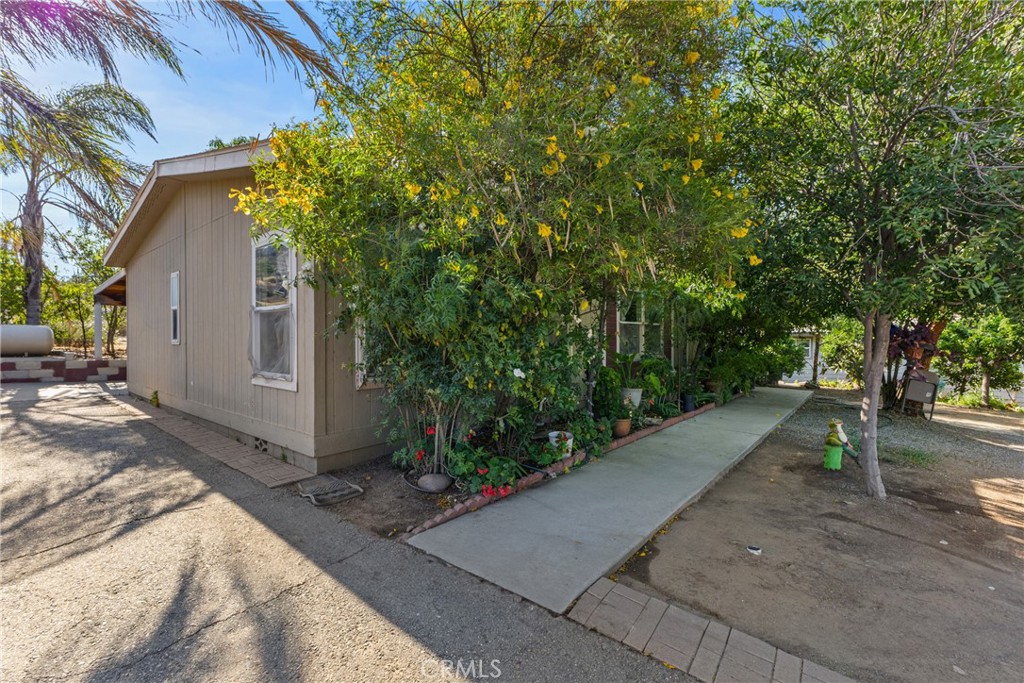Located in a rural residential area, you will find an inviting family home that is warm, welcoming and focused on comfort and practicality. This home features three spacious bedrooms, two full bathrooms, open floor plan style kitchen, dining room, and living room. This home also features a laundry room with a back door that leads to an ample of outdoor space. This home also has lots of big trees for optimal shade. Don't miss this opportunity to own this amazing home.