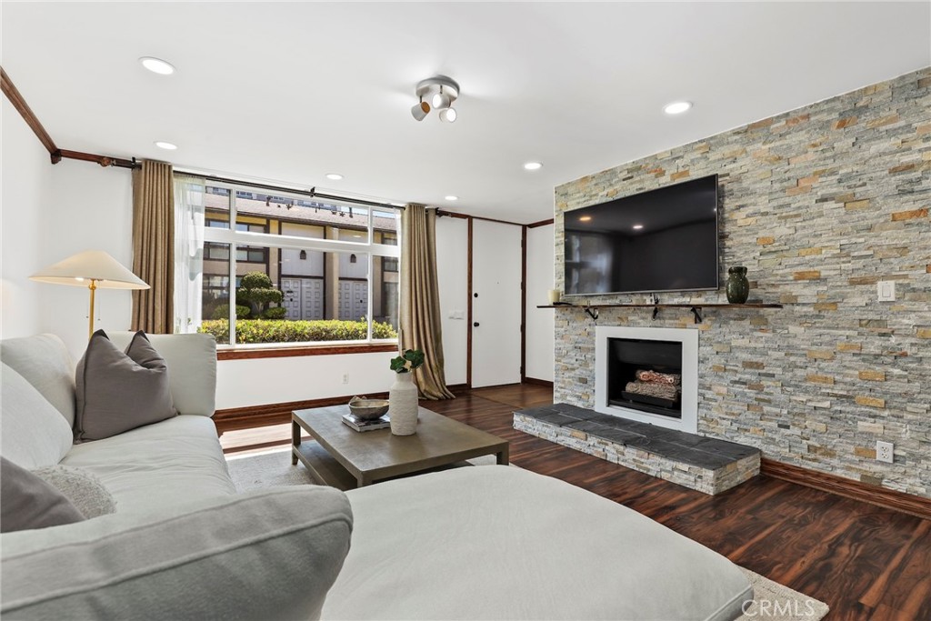 Proudly introducing this beautifully updated 2-bedroom, 2.5-bath townhome-style condo offering 1,336 sq ft of modern comfort in the highly desirable West Torrance neighborhood. Enter into the inviting living room featuring rich red oak laminate flooring and a stunning stone tile accent wall with a cozy fireplace. Modern half bathroom on bottom level that features a deep closet for storage. The renovated kitchen boasts brand new tile flooring, sleek quartz countertops, a farmhouse sink, and all-new soft-close cabinetry. Enjoy stainless steel appliances including a fridge with a built-in media screen and off the rear is a conveniently located laundry area. Adjacent is a formal dining room with a sliding glass door that opens to a private backyard — complete with a covered patio and a spacious storage shed, ideal for entertaining or relaxing outdoors. Upstairs, both bedrooms offer comfort and space, with the primary suite featuring soaring vaulted ceilings, dual closets (including a walk-in), and a completely modernized en-suite bathroom. Additional highlights include 2 side-by-side parking spaces, a dedicated storage cabinet, 5 guest parking spaces and access to a sparkling community pool + spa. Cedar Park Townhomes community is located within a top-rated Torrance school district and just moments from Del Amo Fashion Center, South Bay Galleria, and only minutes to the beach — this is South Bay living at its best!