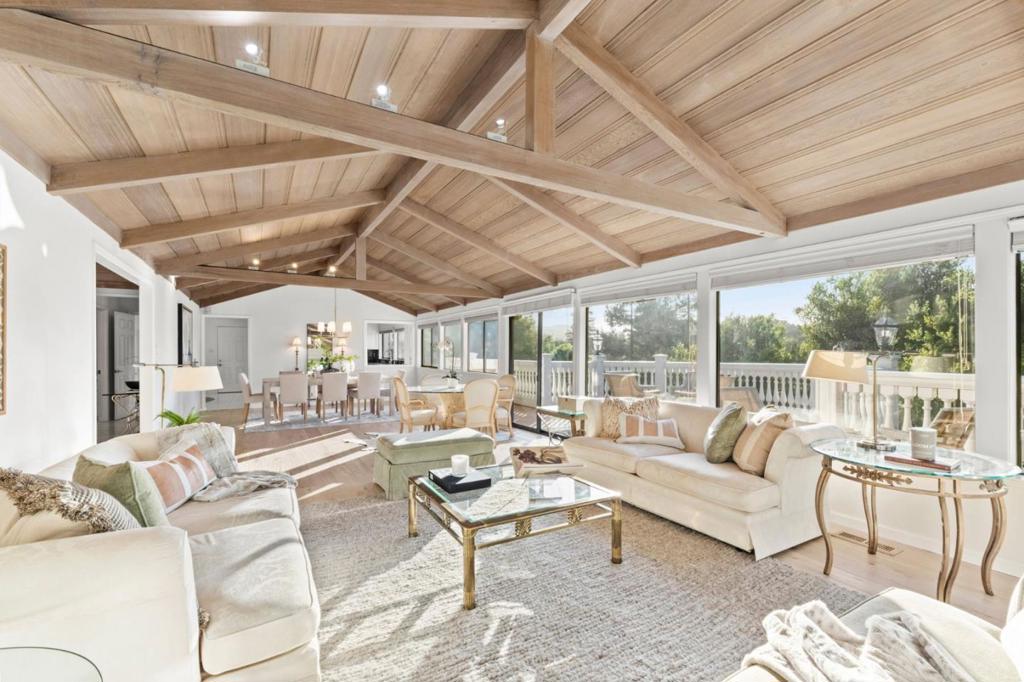 Luxury Live Auction! Bidding to start from $3,700,000.00! 911 Matts Court is a beautifully remodeled 4-bed, 2.5-bath estate that seamlessly blends elegance, comfort, and convenience. Spanning 3,380 sq ft plus a 306 sq ft flexible-use structure, this home showcases timeless architectural design with a terracotta Spanish-style roof, lush landscaping, and exquisite finishes throughout. Rich marble flooring flows through the kitchen, hallways, and bathrooms, complementing a striking solid marble staircase. The expansive living and dining areas feature hardwood flooring, wood-beamed ceilings, and two inviting fireplaces. A chefs kitchen boasts a granite island, premium appliances, and an eat-in dining area, while the family room offers a fireplace, wet bar, and built-in refrigerator. The main-level primary suite provides single-level livability, while spa-like bathrooms showcase elegant marble accents. Outdoor spaces include a terraced rose garden, tile patio, balconies with fiberglass balusters, and a remote-controlled canopy for shaded relaxation. The detached structure is ideal as a home office, gym, studio, or potential ADU. Minutes from downtown Los Altos, top-rated schools, parks, and Stanford shopping, and easy access to Highways 280 & 237 for seamless Silicon Valley commuting.
