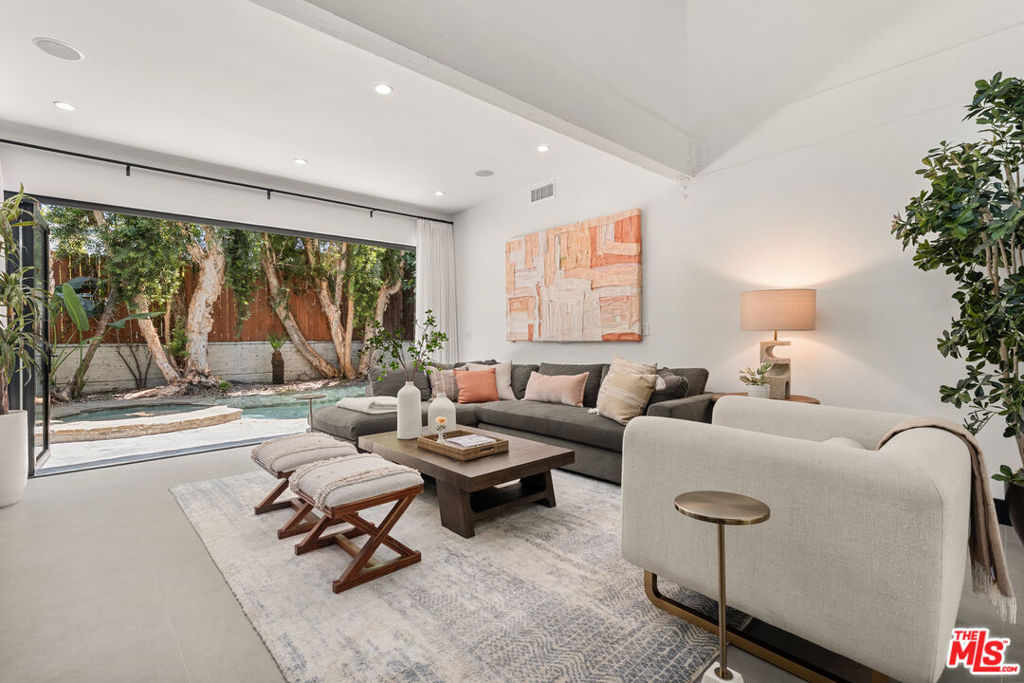 What a great house. Super clean, totally on-trend design with cool fixtures, tiles and custom cabinetry, this 3 bedroom house is set deep off the street on a quiet dead-end street close to a huge park. What an absolutely perfect location - quickly get to all of Studio City's hip restaurants and shopping, as well as the trendiest clubs in Hollywood and downtown LA. The open floor plan kitchen is ideal for hosting sophisticated parties. Everyone will gather in the kitchen and then migrate to the lovely dining room. The soaring high ceiling and expansive disappearing wall of glass that opens to the private backyard continues the setting for that chill vibe. Generous wall space offers an excellent opportunity for impressive personal creative decorating or art collection. The white oak floors create a warm, modern aesthetic. It's a very sexy primary suite with gorgeous bathroom. You'll love the ample natural light. The bathroom suite feels better than a penthouse suite. The entire package rocks a large walk-in closet, soaking tub, glass-enclosed shower, double vanity, beautiful custom cabinetry, and oversized skylights.The main level rooms set up well for home office, creative space, gym, or even roommates. This is a superb and smart investment for a single-family home lifestyle rather than any nearby condos.