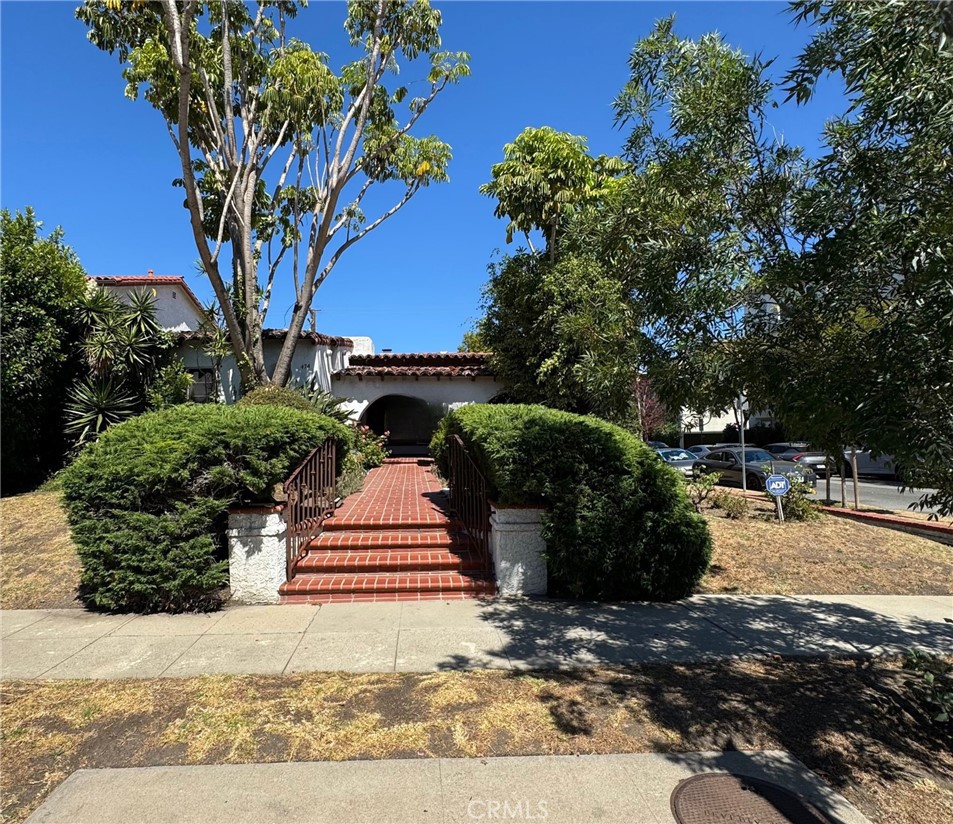 Charming Spanish Corner Lot in Prime Beverly Hills!
Welcome to 474 S Clark Drive, a rare opportunity to own a character-filled Spanish-style home on a desirable corner lot in the heart of Beverly Hills. This 3-bedroom, 2-bathroom single-story residence offers approximately 1,915 sq ft of living space on a 6,331 sq ft lot, rich with original charm and architectural detail.
Features include arched doorways, hardwood floors, vintage tile, and a bright living room with fireplace. The layout includes a large and open living space, a formal dining area located just off the kitchen, and a dedicated laundry room. Two spacious bedrooms share a full bathroom, while the primary suite features its own en-suite bathroom and a walk-in closet. A cozy family room opens directly to the backyard, creating a seamless indoor-outdoor flow.
The detached garage provides excellent potential for an ADU, home office, or creative studio. Located within the highly sought-after Beverly Hills Unified School District and just moments from world-class shopping, dining, and entertainment, this property presents a unique opportunity to restore, expand, or rebuild in one of the most prestigious neighborhoods in Los Angeles!