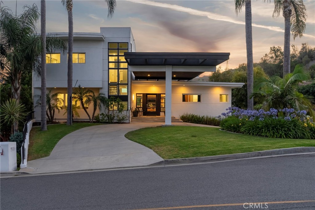 Set in the heart of Villa Park—a city celebrated for its large lots, minimal commercial development, and strong sense of community—9111 Loma Street is a rare opportunity to own a refined, multi-generational estate in one of Orange County’s most exclusive enclaves. This 4-bedroom, 5-bathroom custom residence is thoughtfully designed for flexible living, blending elegance with everyday function. The home features expansive living spaces filled with natural light, soaring ceilings, and curated finishes throughout. The gourmet kitchen is the true centerpiece—equipped with high-end appliances, custom cabinetry, and a charming coffee nook perfect for quiet mornings or casual hosting. Ideal for households needing additional living quarters, the property includes a private in-law suite with its own entrance, en-suite bath, and laundry—offering comfort and privacy for extended family or live-in support. One bedroom has been transformed into a modern office, and the newly renovated basement level features a state-of-the-art theater room for an immersive home cinema experience. A private elevator ensures seamless access across all levels, making the home both convenient and age-friendly for long-term living. Newly added RV parking offers extra flexibility for guests, recreational vehicles, or storage. Step outside to your own private oasis. The expansive backyard showcases lush landscaping, multiple patios, and a sparkling pool—perfect for relaxing or entertaining under the California sun. Living in Villa Park means enjoying wide, peaceful streets, top-rated schools, a tight-knit community, and the privacy of estate living—all within minutes of major freeways, beaches, and shopping hubs. With its timeless appeal, functional layout, and premier location, 9111 Loma Street is more than a home—it’s a legacy property in a city where homes rarely come to market.
