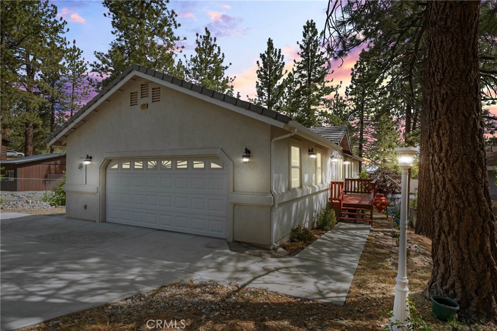 GORGEOUS TURN KEY NEWER BUILD SILVERTON HOME ALL ON A SINGLE STORY WITH EASY ACCESS TO LONE PINE CANYON AND LOTS OF EXTRAS!! PRIDE OF OWNERSHIP ABOUNDS!! Check out this 3 bedroom 2 bathroom home on a LARGE LOT and completely ready to move right in. An AMAZING FLOOR PLAN features an OPEN KITCHEN to dining to living room feel. The beautiful FIREPLACE is sure to please on those chilly mountain evenings. Engineered mahogany HARDWOOD FLOORS in the main living area are a nice compliment to the mountain feel. The kitchen sports plenty of cupboard and counter space and a PANTRY for the Costco haul! Easy access from your 2 CAR GARAGE to mud room/laundry room to the kitchen as well. The dual pane slider from dining room to side deck is perfect for summer time BBQ's and entertaining. Down the hall to your LARGE MASTER SUITE and 2 other bedrooms. The master features a nice sized walk in closet, access to the side deck, DUAL VANITY, oversized bathtub and separate shower for relaxing or the morning routine. Two more bedrooms feature lots of light, extra closet space and the back bedroom offers access to the rear deck. VINYL DUAL PANE WINDOWS throughout and 2 x 6 construction offer extra insulation to maximize ENERGY EFFICIENCY and silence any outside noise. Other extras include A/C, SECURITY SYSTEM (To be conveyed with sale), and new hot water heater. Down below, a LARGE PRISTINE BASEMENT is perfect for storage or could be developed for additional space like a workshop. FRUIT TREES abound outside, and a drip system helps keep everything healthy through the Summer. RV ACCESS!!! Featuring 2 RV spots, one with a FULL HOOKUP AREA, and includes a septic catchment for easy dump options. Surrounded by majestic pines and easy commuter options, this property is ready for the family ready to call Wrightwood their forever home!