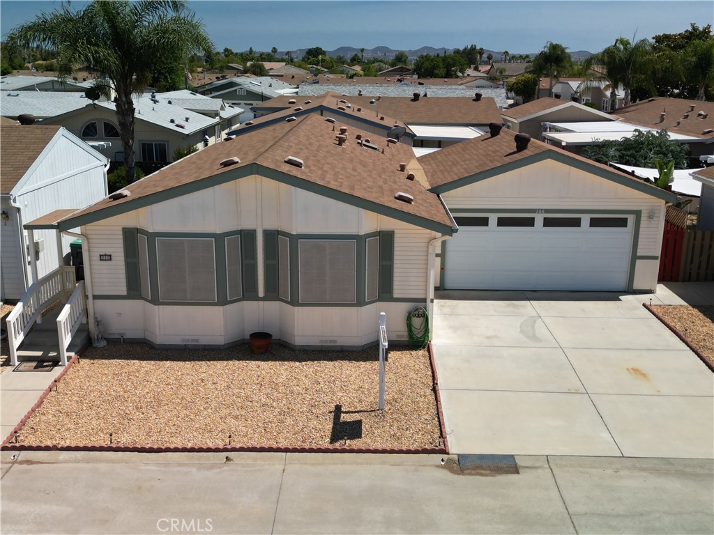 ***MOVE-IN READY 55+ SUN CITY GEM*** PRICED TO SELL FAST***
Welcome to your serene new oasis in the Sun Meadows gated 55+ community, perfectly positioned on a peaceful cul-de-sac. This charming, single-story manufactured home offers 1,200 square feet of thoughtful living space, featuring:
• 2 bedrooms and 2 full baths, including a primary suite with dual sinks and walk-in shower.
• Built in 2001, this home presents a modern, well-maintained interior with plantation shutters and ceiling fans throughout.
• Inviting living & dining area, complemented by a cozy fireplace and vaulted ceilings.
• Functional kitchen with ample cabinet space, and in-home laundry with washer/dryer included.
• Bright secondary bath complete with skylight
Outdoor living shines with a covered patio—ideal for morning coffee or evening relaxation. A spacious attached 2-car garage offers convenience and storage, while well-manicured grounds enhance the low-maintenance lifestyle.
Enjoy access to the clubhouse, pool, spa, sauna, gym, shuffleboard, putting green, temmis, picleball, horseshoes, card room, library with crafts, sewing and ceramics, billard room, and community events—all designed for an exceptional 55+ lifestyle.
Nestled in Sun City (Menifee), you’re just minutes away from shopping, dining, healthcare, and outdoor recreation, including Temecula wineries just 30 minutes away. Don’t miss this rare opportunity to own in a friendly, gated senior community where quality, comfort, and convenience come together. Perfect for downsizers, retirees, or those seeking a low-maintenance, community-rich lifestyle.