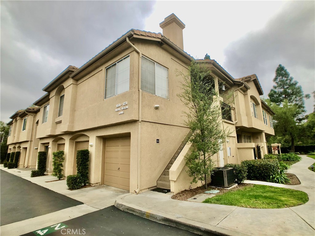 Corner-end unit condo in a prime Aliso Viejo location. This well-maintained 2 bedroom, 2 bath home offers excellent privacy with no one above or below. The first floor includes a direct-access garage, while upstairs you’ll find a spacious master suite with a walk-in closet and ample storage. The open-concept living area features high ceilings, abundant windows, and natural light throughout. Laminate and tile flooring span the home with no carpet, and in-unit laundry hookups add convenience. A good-sized front patio provides space for outdoor enjoyment. Community amenities include a pool, spa, nearby parks, and scenic walking trails. Centrally located with easy access to freeways, shopping, dining, and beaches, this home blends comfort, convenience, and location — ready for you to move in and enjoy all that Aliso Viejo has to offer.
