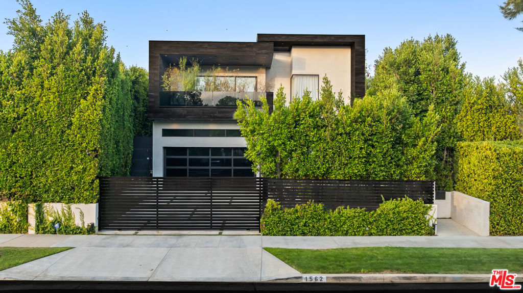 Incredibly rare lease opportunity in the highly sought after Comstock Hills neighborhood. This modern 5 bedroom home offers exceptional privacy, state of the art security, and luxurious living in one of West Los Angeles's most exclusive residential pockets. Built in 2017, the residence is fully gated with a 6 foot steel front privacy fence, 8 foot steel side yard gates for added security, and a solid steel entry door. A fully integrated intercom system and a robust multi camera surveillance network provide unmatched security and peace of mind. Inside, the home features a fully automated smart system controllable from your phone, open concept living, and top of the line finishes throughout. The custom kitchen showcases an oversized island, brass fixtures, custom cabinetry, and premium appliances, opening to a spacious living area with seamless indoor outdoor flow.The backyard is a private retreat with a gated pool and electronic cover, a built in BBQ, an outdoor bar, a fire pit, and ample space for entertaining. The home includes a full gym equipped with a Woodway treadmill, VersaClimber, and additional training equipment. A dedicated wine cellar and powder room are also located on the main level.Upstairs, four bedrooms include a primary suite with a spa style bathroom, his and her walk in closets, and oversized windows. The ultra private rooftop deck offers panoramic views of the Century City skyline, the Los Angeles Country Club, and the ocean on clear days. Owner prefers long term tenants. Walking distance to Westfield Century City, Beverly Hills shopping, and premier dining. Minimum 12 month lease. Shown by appointment only. Do not disturb occupants.