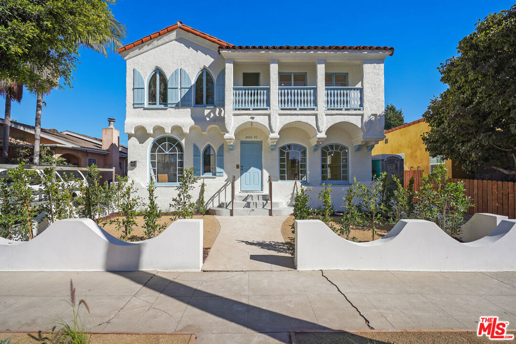 Alluring 1935 Spanish Revival in the Heart of West Adams-2 Bedroom, 1 Bath. Step into the timeless elegance of 1935 with this exquisitely preserved Spanish Revival unit, located in the coveted West Adams District of Los Angeles. This 2-bedroom, 1-bath gem exudes character and historical charm, perfectly blending period style and modern comfort. From the moment you arrive, the architectural details transport you to a bygone era of craftsmanship, with every curve and corner thoughtfully designed to evoke a sense of history and sophistication. The unit s facade, with its crisp white stucco exterior, terracotta tile roof, and soft blue accents, is a classic example of the Spanish Revival architecture that swept Los Angeles in the early 20th century. The unique arched windows adorned with decorative shutters invite sunlight to dance through the interiors, creating a warm and welcoming ambiance. These striking arched and semi-circular windows provide architectural interest and a perfect frame for the lush, tree-lined street views. Inside, the living room opens up with an airy, spacious feel, accentuated by high, textured ceilings and period-correct plaster walls that exude character. A sculpted decorative fireplace becomes the room s focal point, reminding you of the home s 1930s roots while adding a touch of romance to the space. New floors span the unit; their warmth sets the perfect backdrop for easy living, creating a seamless flow between rooms. A Thoughtful Blend of Vintage and Contemporary while maintaining its historic integrity, this unit has been updated for today's lifestyle. The remodeled kitchen combines modern amenities with vintage-inspired cabinetry and fixtures that complement the unit's original style. Large, classic windows line the walls, flooding each room with natural light and bringing out the rich tones of the interior design. The bathroom retains vintage charm with tasteful tilework that nods to the period style, harmonizing beautifully with the home s overall aesthetic. This unit's private front yard, framed by elegant, curved walls and lush landscaping, offers a charming outdoor space that feels secluded and inviting. Enjoy an evening on the front porch, overlooking the beautifully landscaped yard and appreciating the classic California sunsets. With easy access to West Adams' trendy cafes, local shops, and cultural landmarks, this home offers a lifestyle that blends the best of historic LA charm with modern urban convenience.