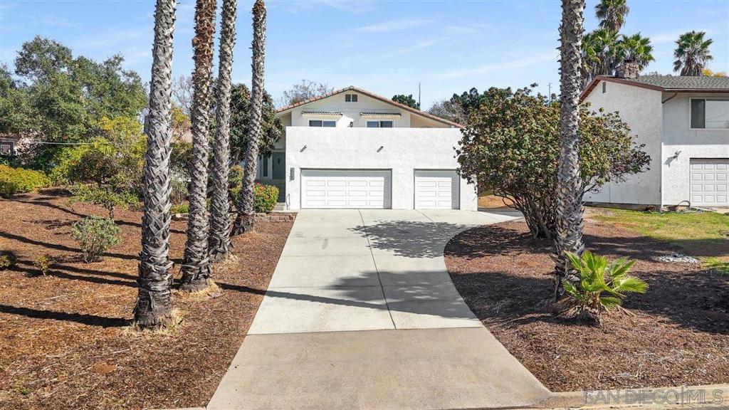 Nestled in the sought-after Southwestern neighborhood in Escondido, this extraordinary residence boasts 5 large bedrooms, 3 bathrooms, and 2,224 square feet of comfortable living on a .53-acre lot, ideal for families who value entertainment, space & privacy. The mid-level spacious living area hosts a chef's kitchen with a huge island, stainless steel appliances, white shaker cabinets and quartz counters. The upper level has 3 bedrooms, two of which front onto an upper deck with space for outside dining while watching gorgeous sunsets. The lower level has 2 bedrooms that could host a separate income producing ADU and/or media room and extra bedroom. A 3-car garage adds convenience with lower level house access & driveway spaces for 3+ cars. The meticulously kept yard is a tranquil oasis, adorned with mature shade trees and a large level pad ready for a Playground, RV parking, Pool, Horses/Equestrian use or build an added ADU. The front yard has Orange, Tangerine & Meyer Lemon fruit trees. This home is perfectly positioned near Lake Hodges, Del Dios Highlands County Preserve & Daley Ranch trails, offering many opportunities for hiking, biking & outdoor adventures. Dixon Lake is 8 miles away for boating and fishing. You can enjoy walks to favorite restaurants & shopping. Middle School students can walk to the prestigious Del Dios Academy. This property is not to be missed!