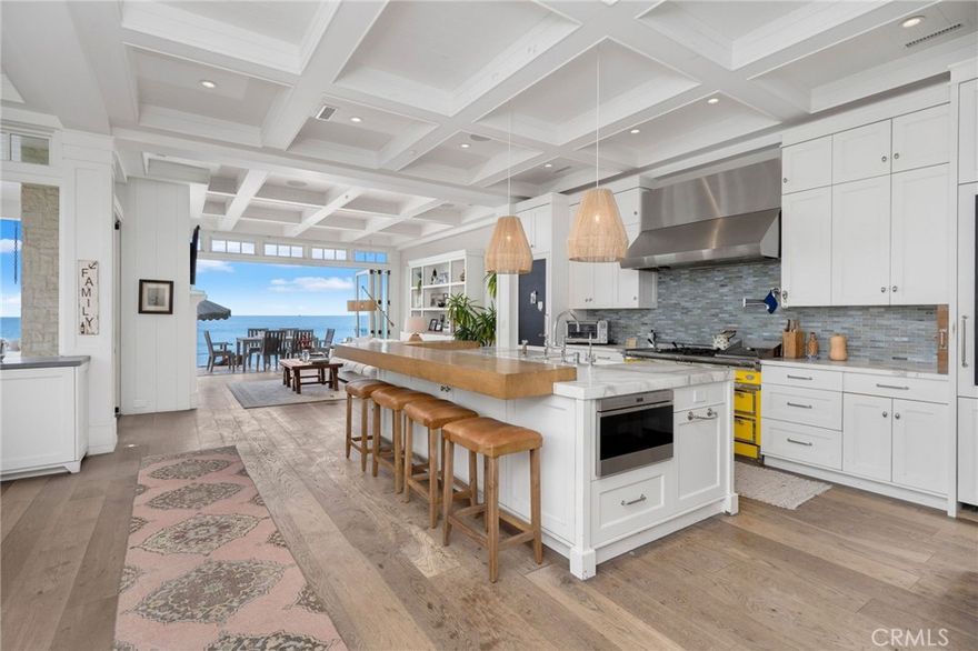Experience the pinnacle of coastal luxury with this brand-new custom residence located on the exclusive guard-gated stretch of Beach Road in Dana Point. Designed by world-renowned TOMARO Architects, this estate seamlessly blends timeless Cape Cod inspiration with modern elegance, offering an unmatched opportunity for beachfront living.



Spanning three levels, the home has been thoughtfully designed to maximize breathtaking panoramic views of the Pacific Ocean, Catalina Island, and dramatic sunsets. Floor-to-ceiling glass walls, expansive decks, and seamless indoor-outdoor transitions create an open and light-filled coastal sanctuary.



The residence features a gourmet chef’s kitchen, spacious great room, formal dining, private office, and multiple entertainment spaces designed for gatherings large and small. Upstairs, the luxurious primary suite boasts sweeping ocean vistas, a spa-inspired bath, and a private terrace overlooking the sand and surf. Additional bedrooms are generously scaled with en-suite baths, providing both comfort and privacy.



A rare oversized beachfront lot allows for generous outdoor living spaces including a seaside patio, landscaped entry court, and private beach access. Modern engineering and advanced stormwater/erosion control systems have been meticulously integrated to ensure the property’s long-term strength and stability.



Located just minutes from Dana Point Harbor, the Ritz-Carlton, and Monarch Beach Resort, this one-of-a-kind residence represents the ultimate in design, setting, and lifestyle. Few properties combine such architectural pedigree, modern craftsmanship, and a true oceanfront address.